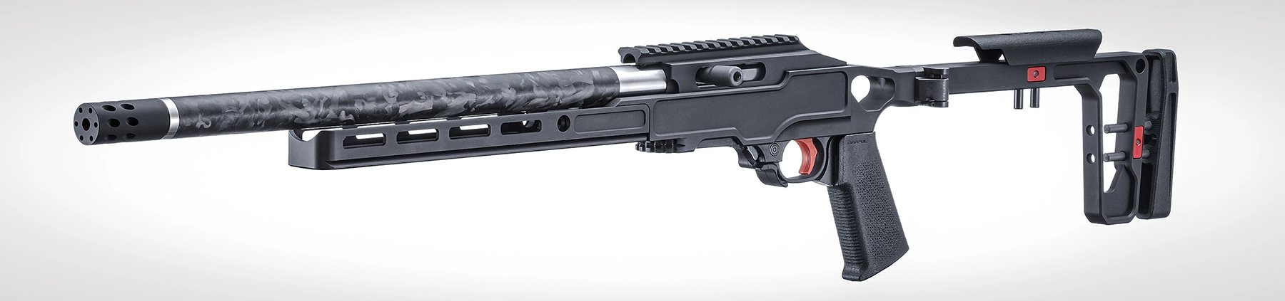 The Ruger 10/22 Carbon Rifle with a Black Anodized Grey Birch Chassis stock