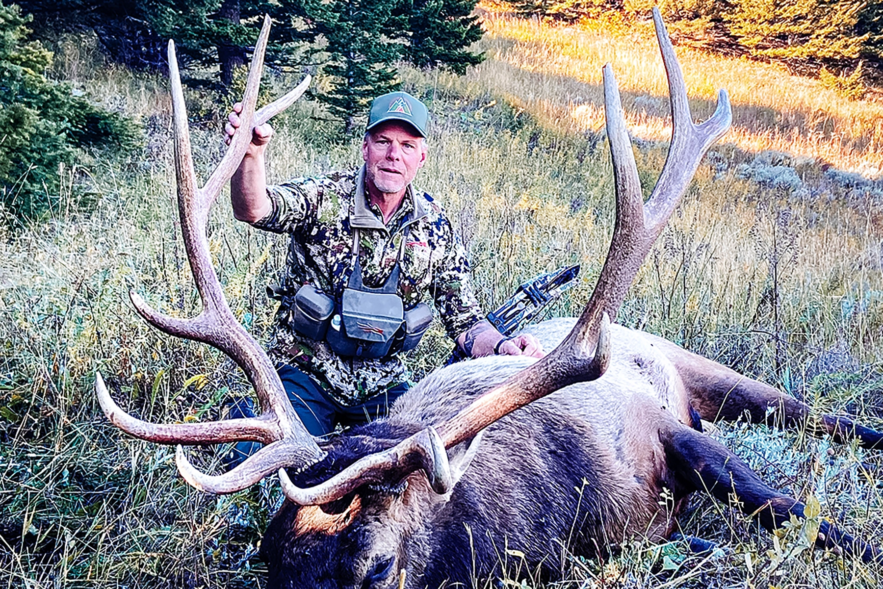 John Barklow with a downed bull elk