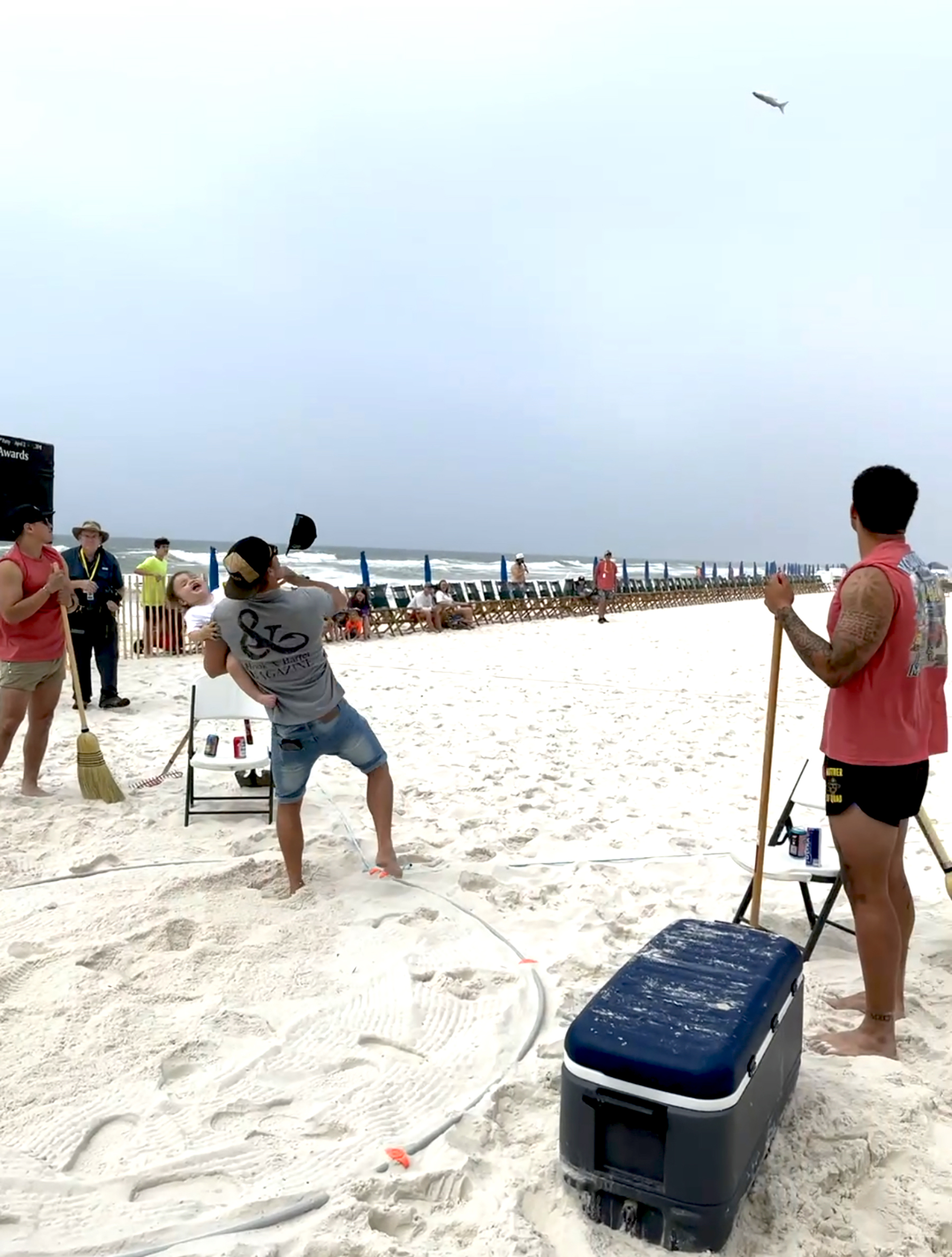 John Radzwilla tosses a mullet with his son