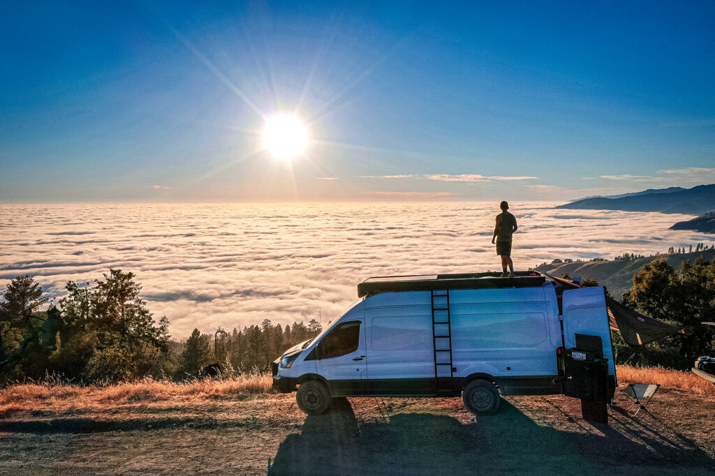 conversion van in front of sun and clouds