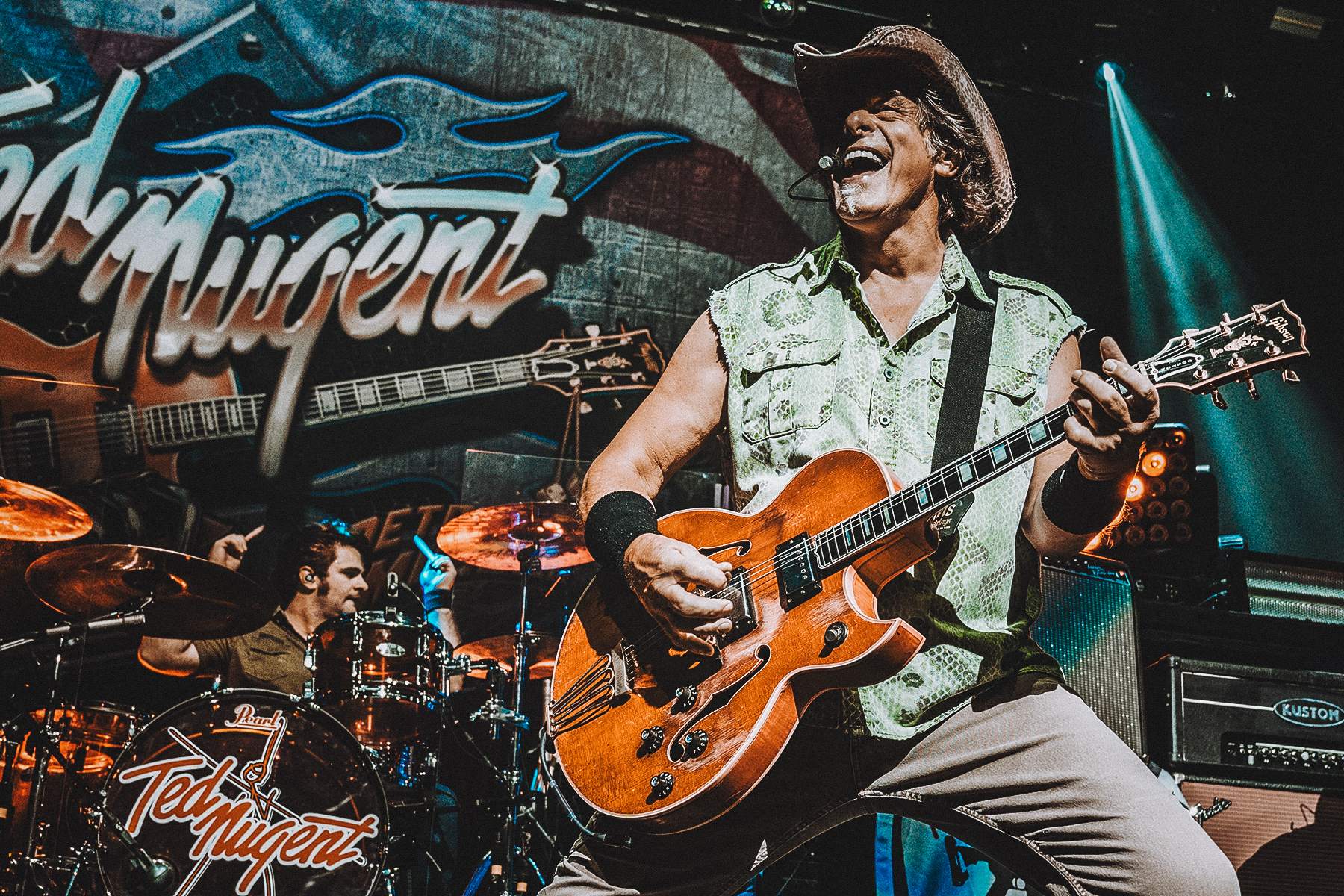 ted nugent on stage playing guitar