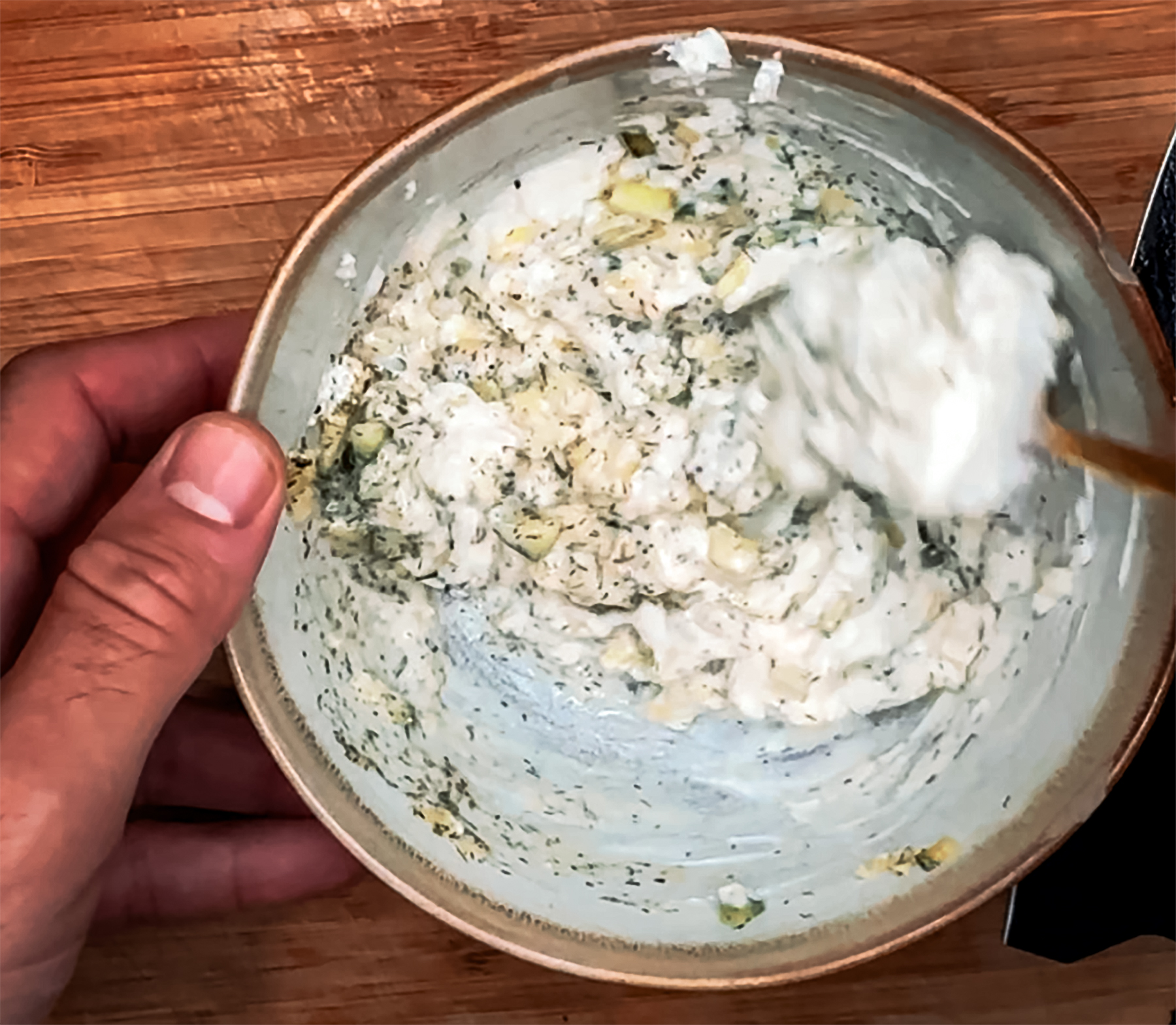 mixing the tzatziki sauce