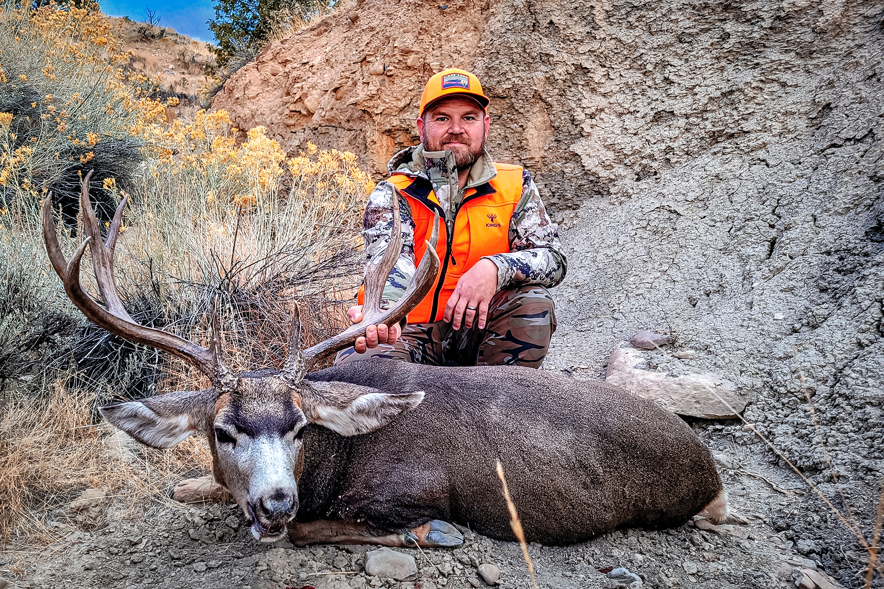 Barnes Harvest hunting ammunition hunter with a nice muley buck