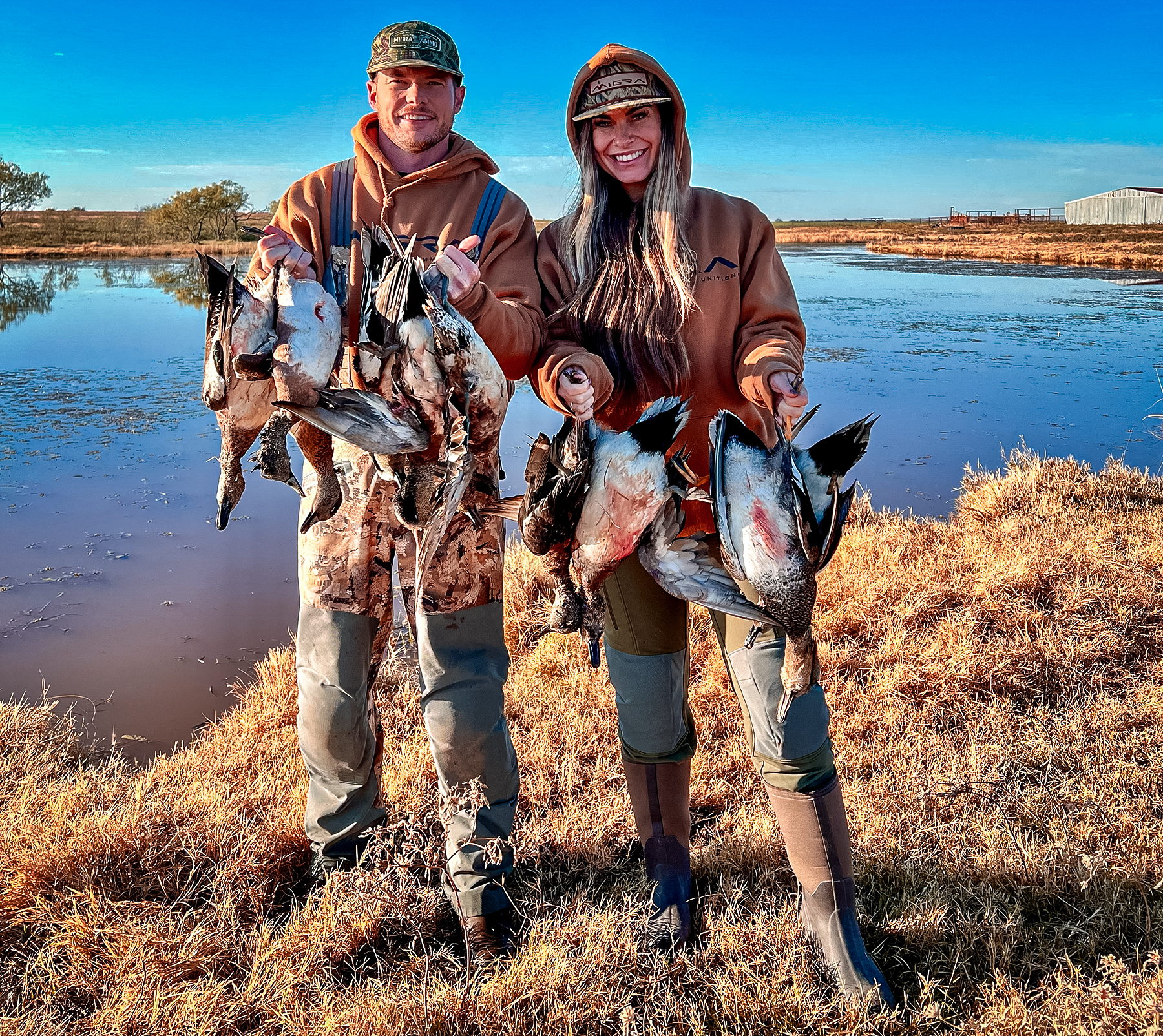 Drew McIntosh of Migra Ammunition with a fellow hunter and ducks