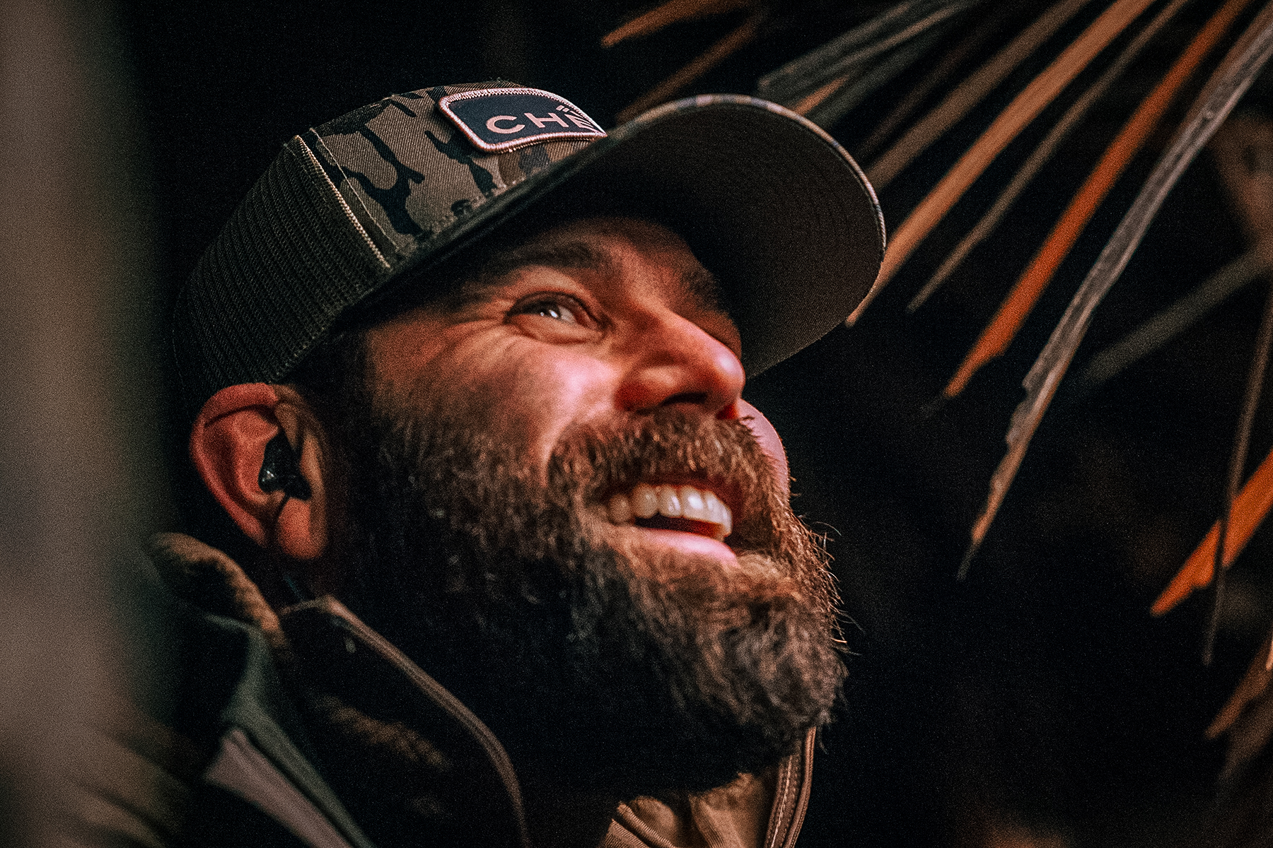 Jordan Davis smiling in a duck blind