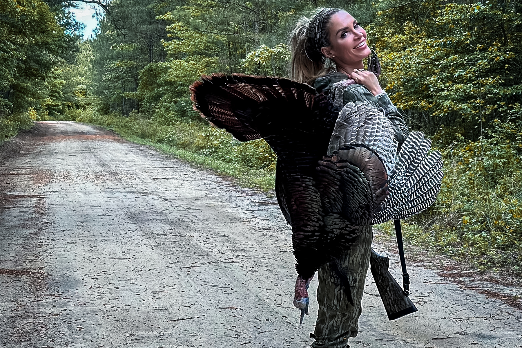 lauren brown with a turkey and a shotgun