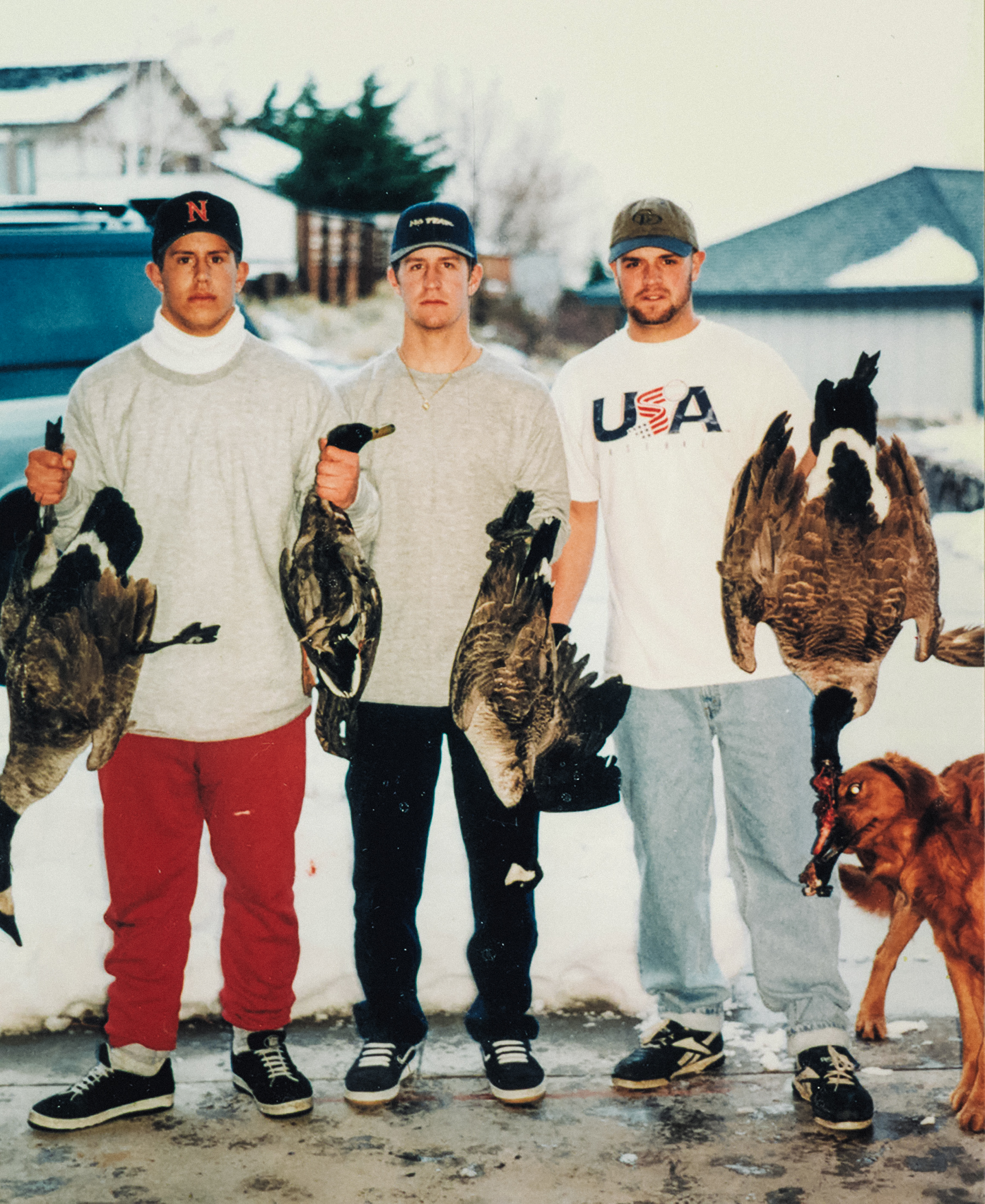 chad belding in his younger years with his brothers and ducks