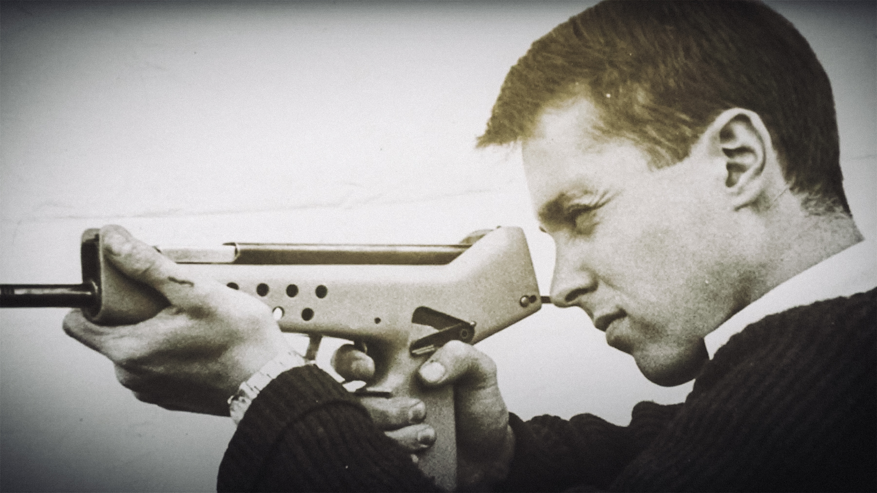 George Kellgren in younger years with a prototype firearm
