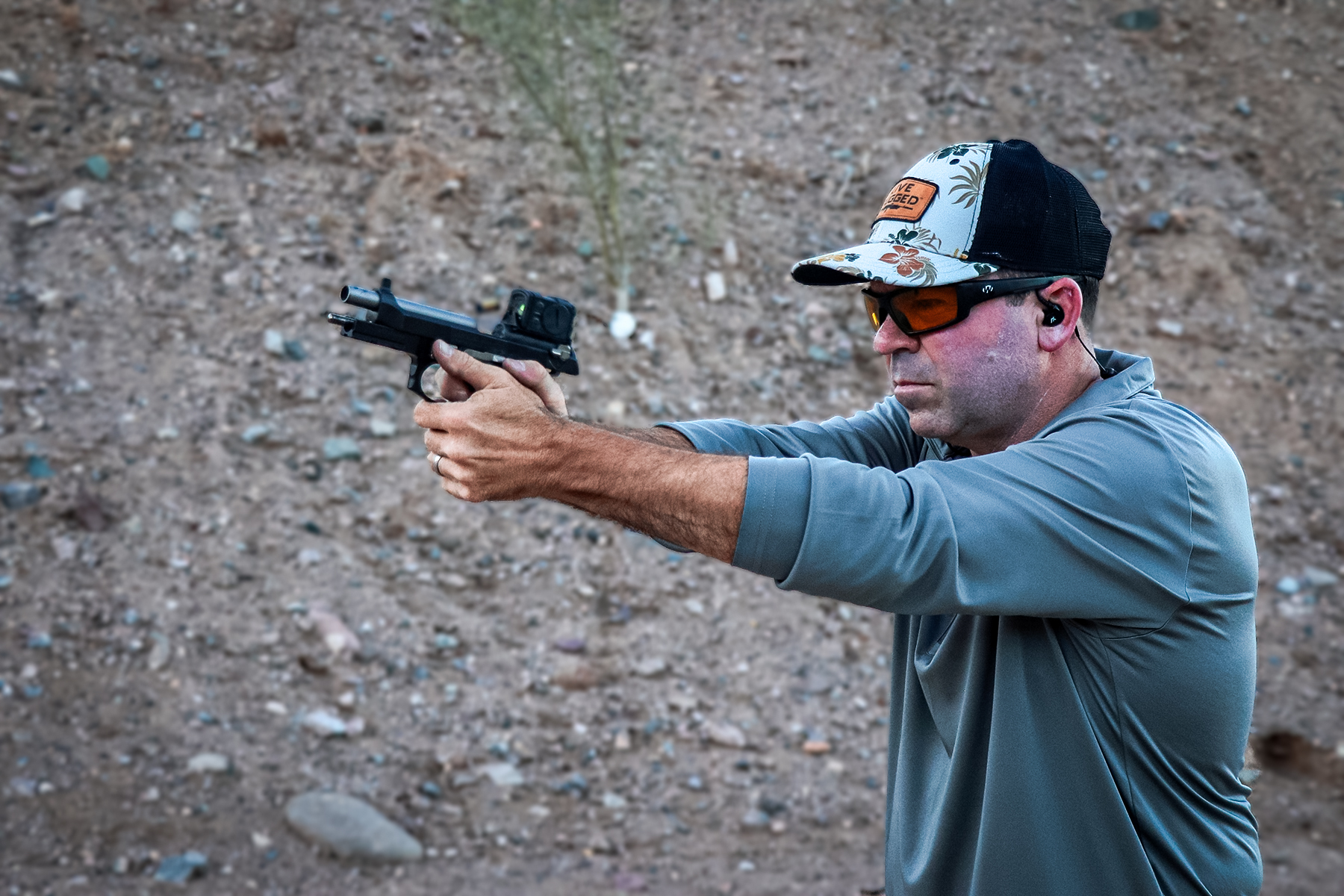 the author shooting the LTT Beretta 92G pistol