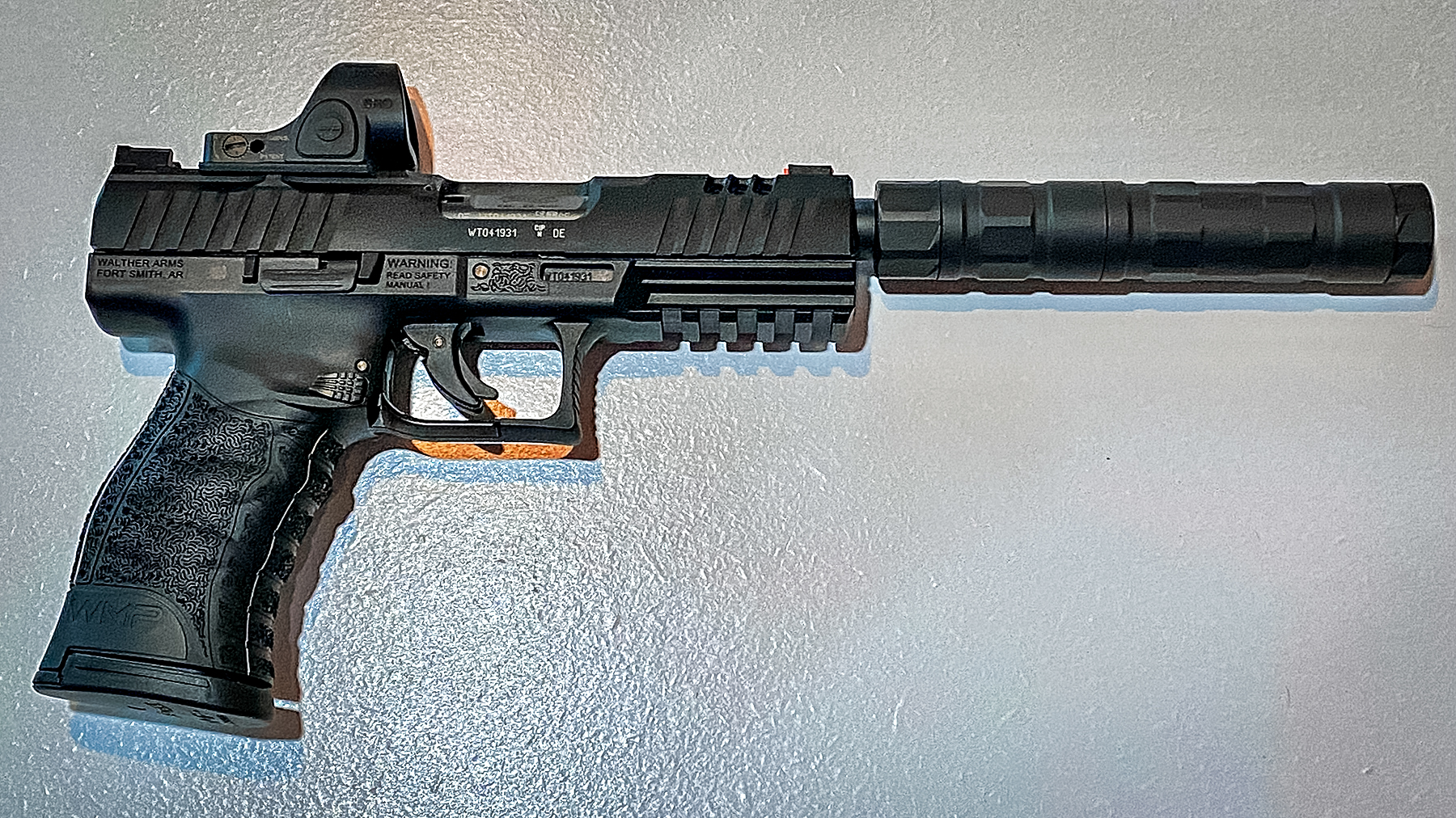 Walther WMP SD pistol with a Trijicon SRO red dot and a SilencerCO Switchback Suppressor
