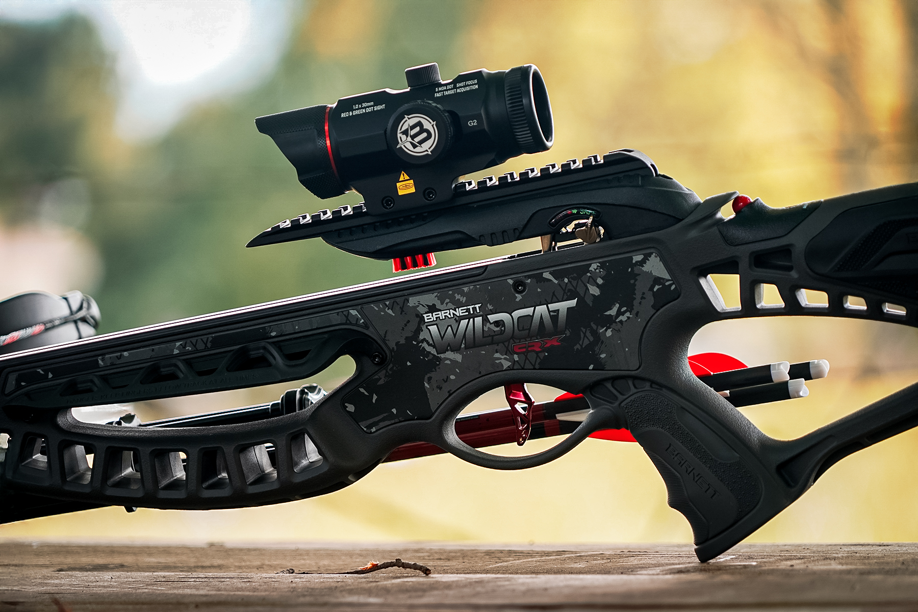 left side featuring the included red-dot precision optic