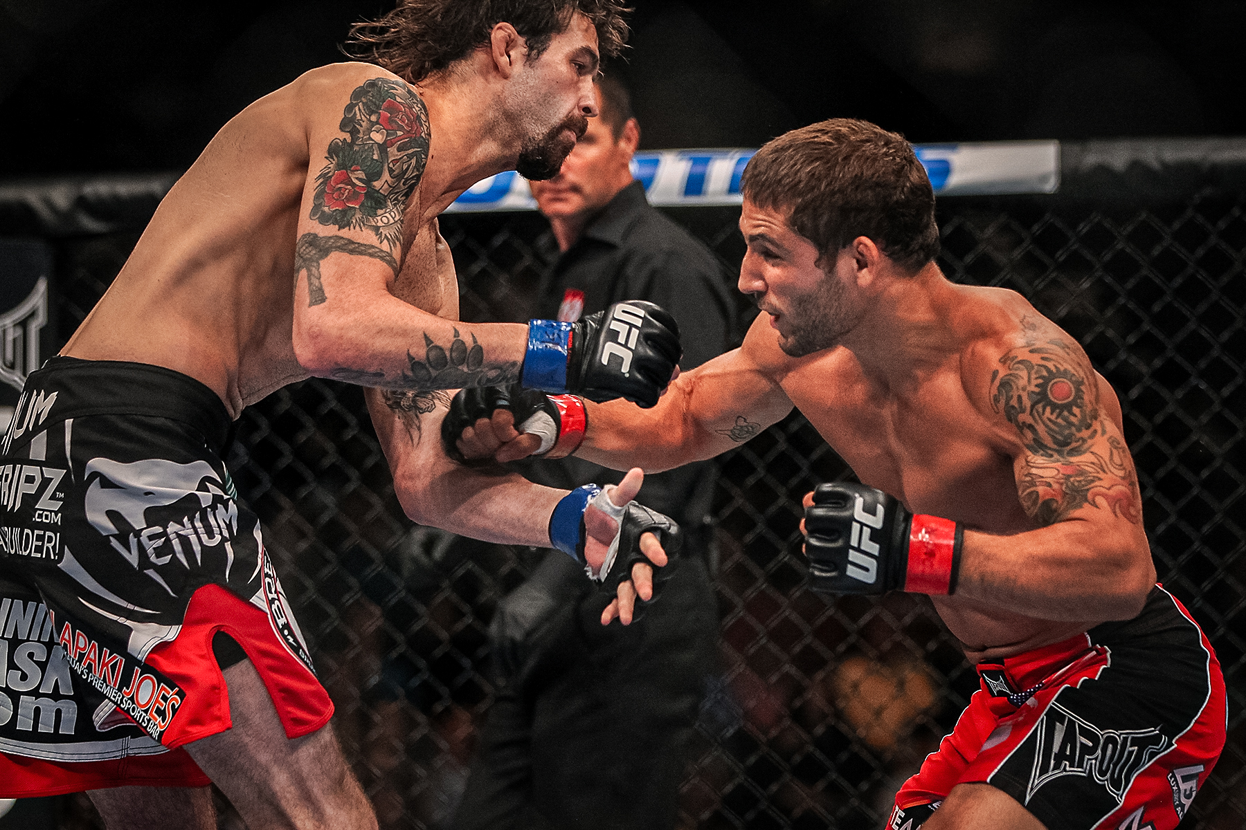 Chad Mendes fighting in the octagon