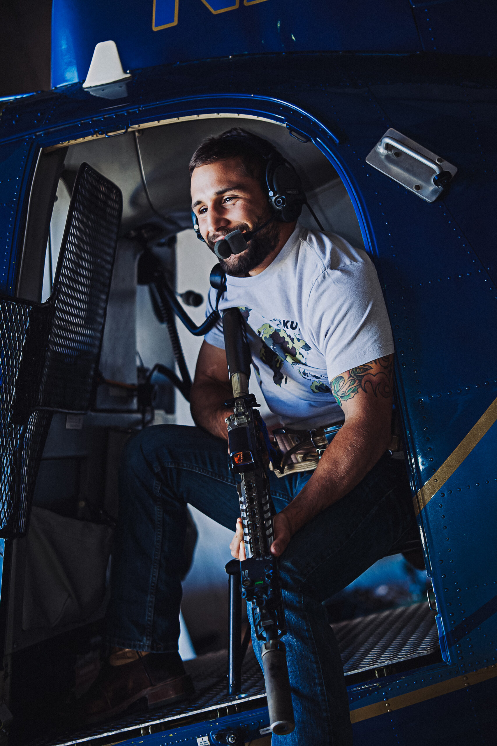 Chad Mendes shooting an AR from a helicopter