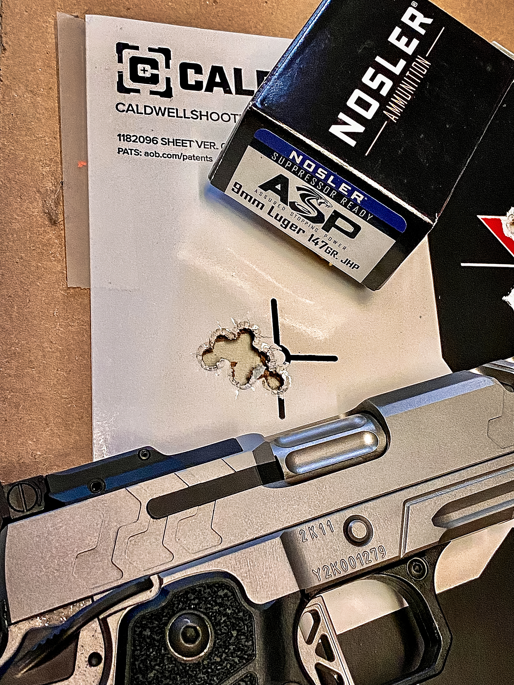Kimber 2K11 Stainless Comp with Nossler 9mm ammo and target