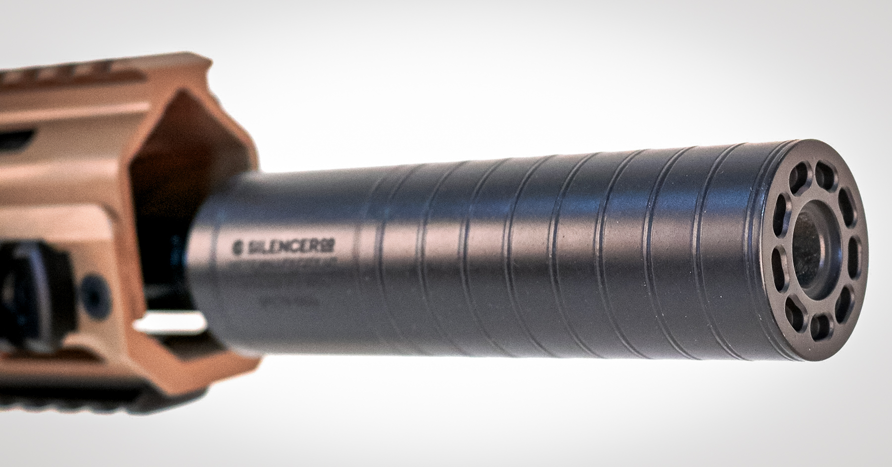 a SilencerCo Spectre 9 suppressor installed