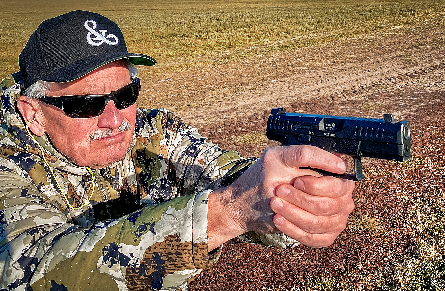 author firing the CZ-USA P-10 C Ported handgun