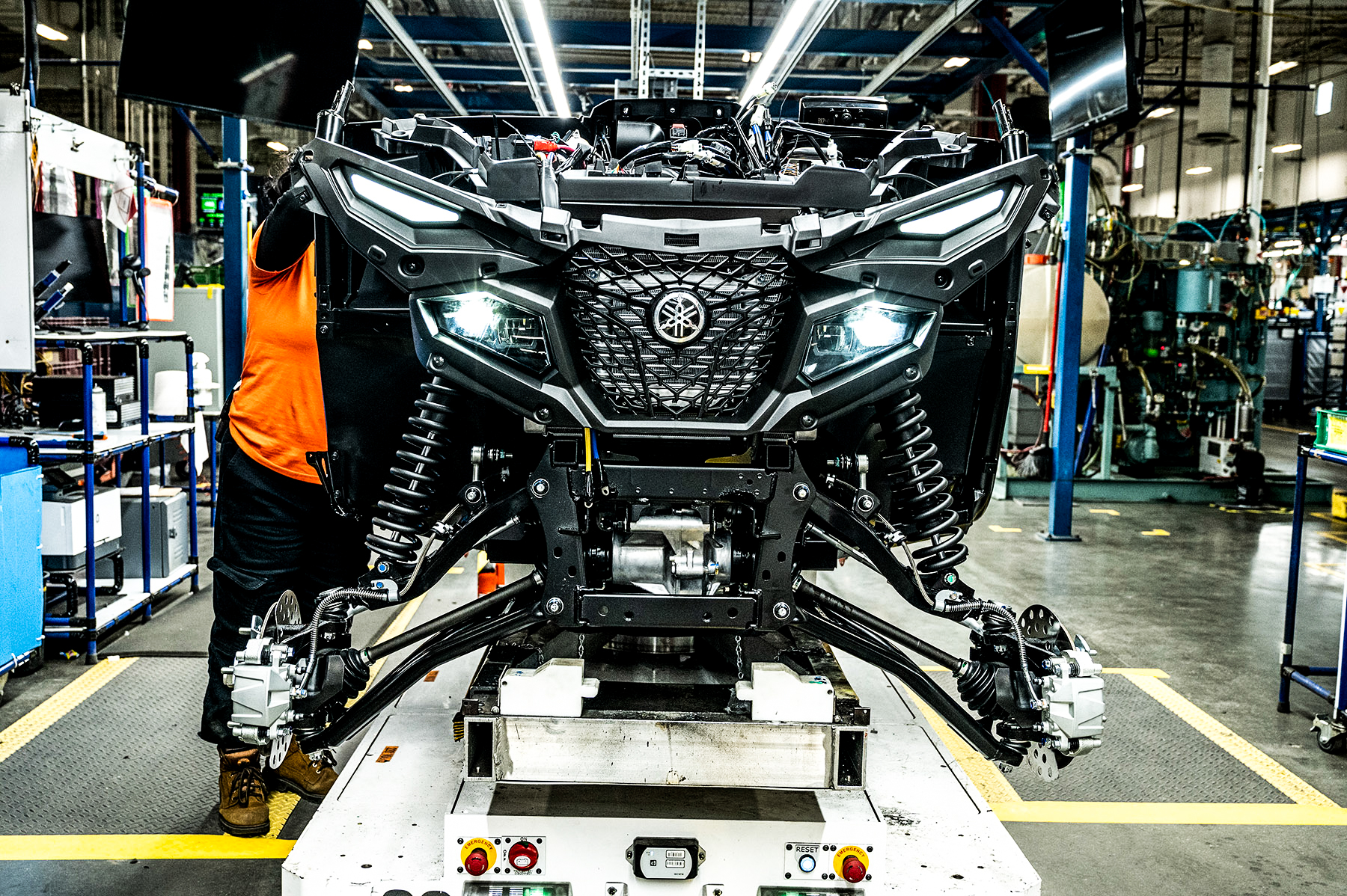 Yamaha assembly line partially constructed Grizzly with headlights on