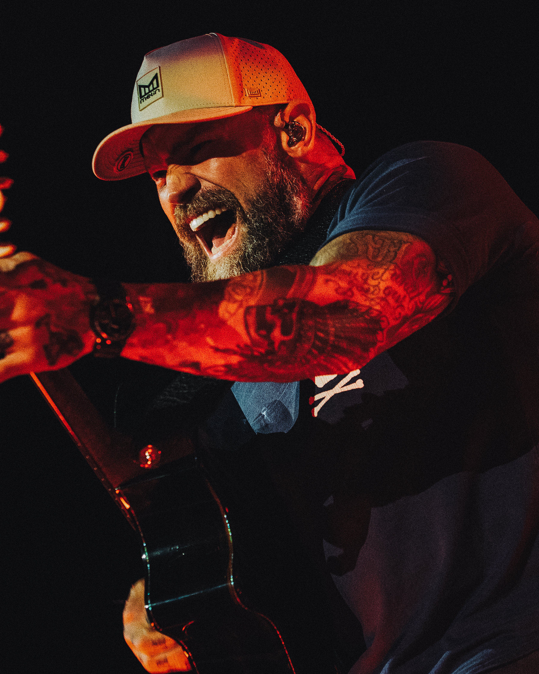 Zac Brown shredding on guitar on stage