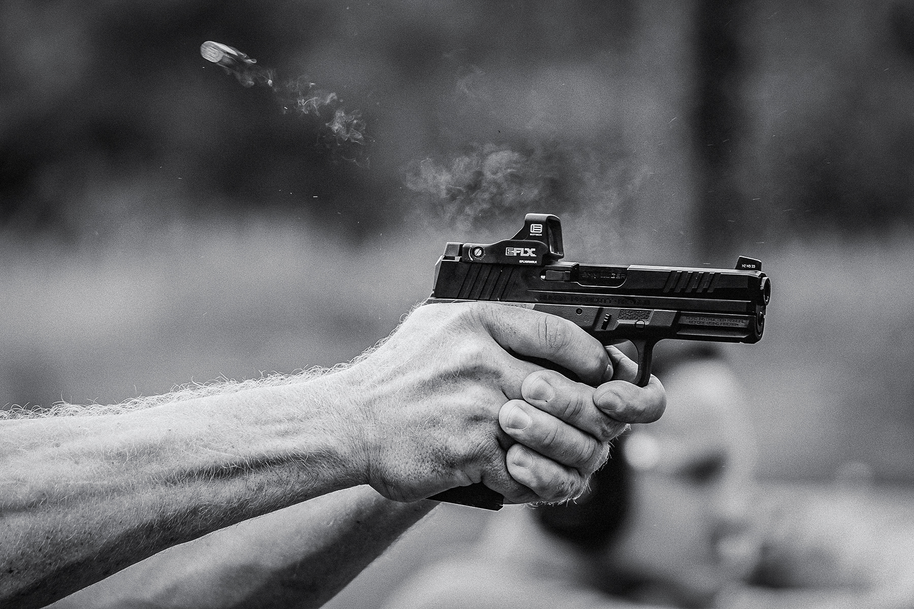 Ruger RXM handgun firing with red dot