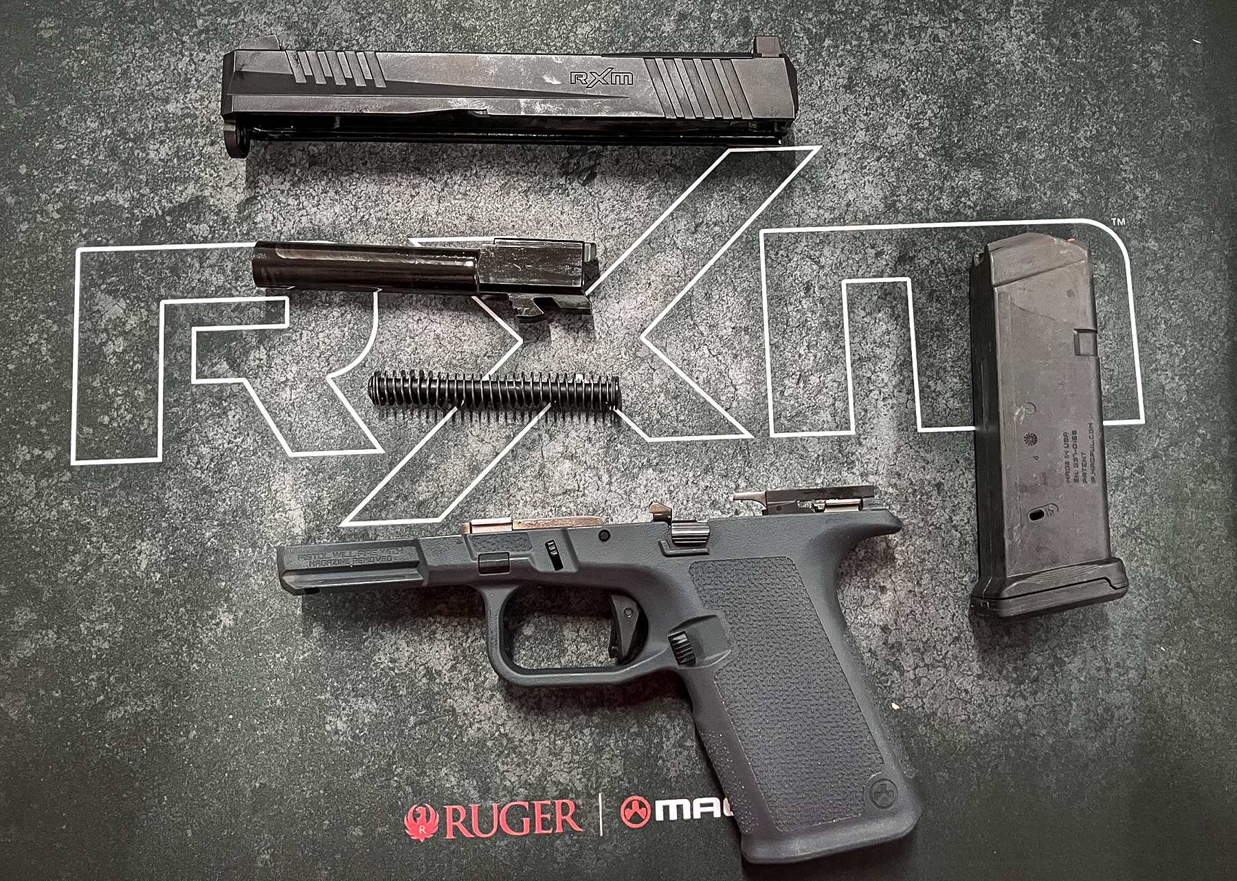 Ruger RXM handgun disassembled