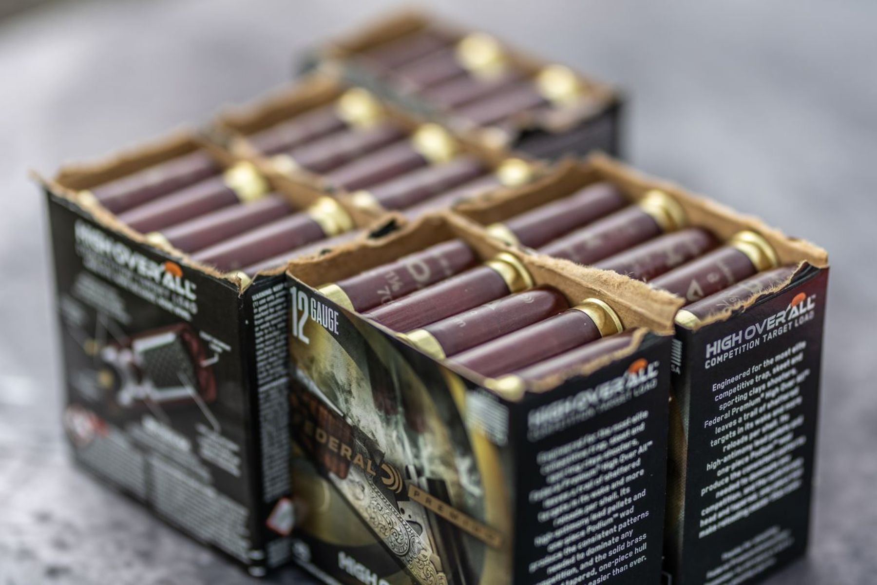 12 gauge shotshells lined up in boxes