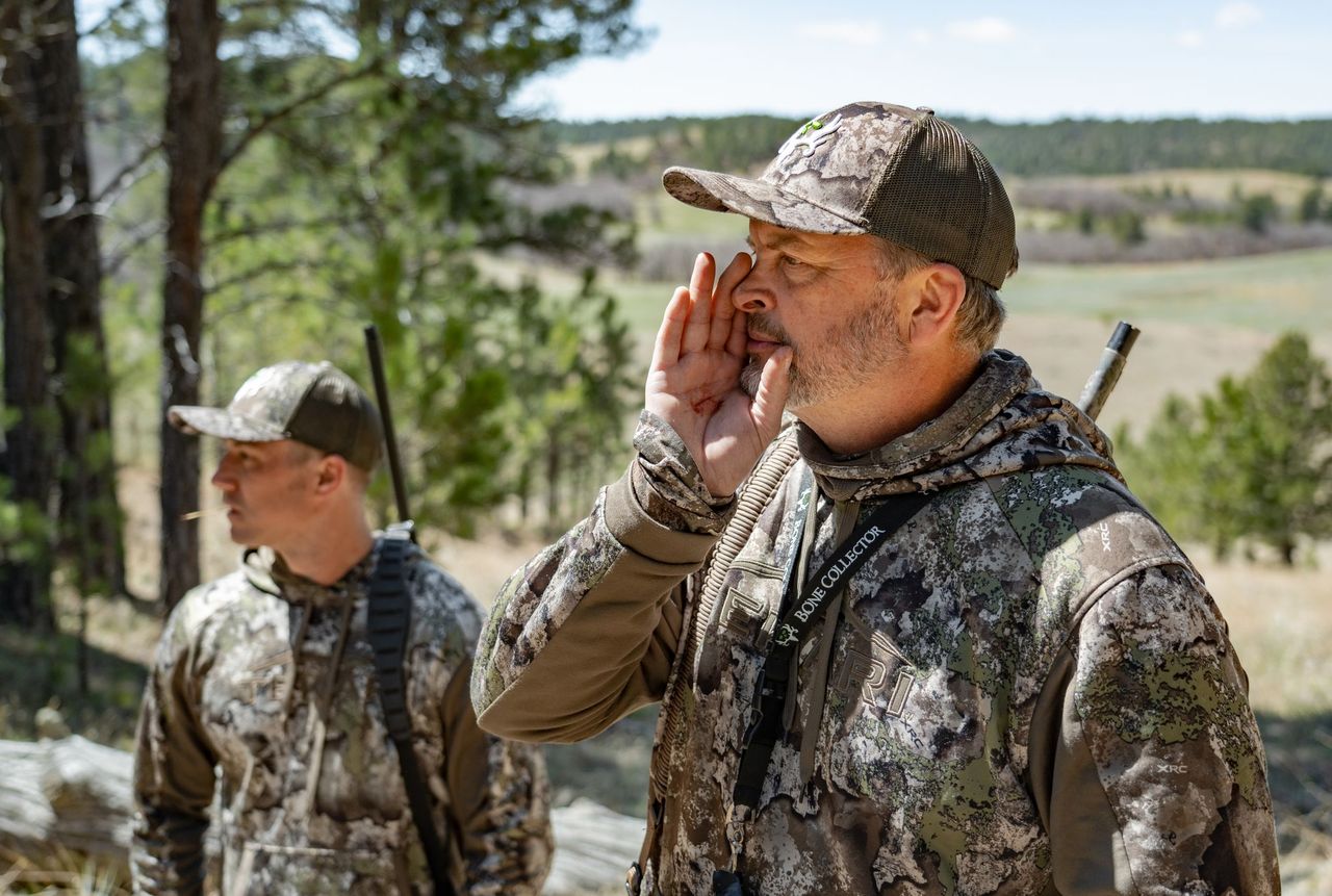 Michael Waddell calls a turkey with a diaphragm call.