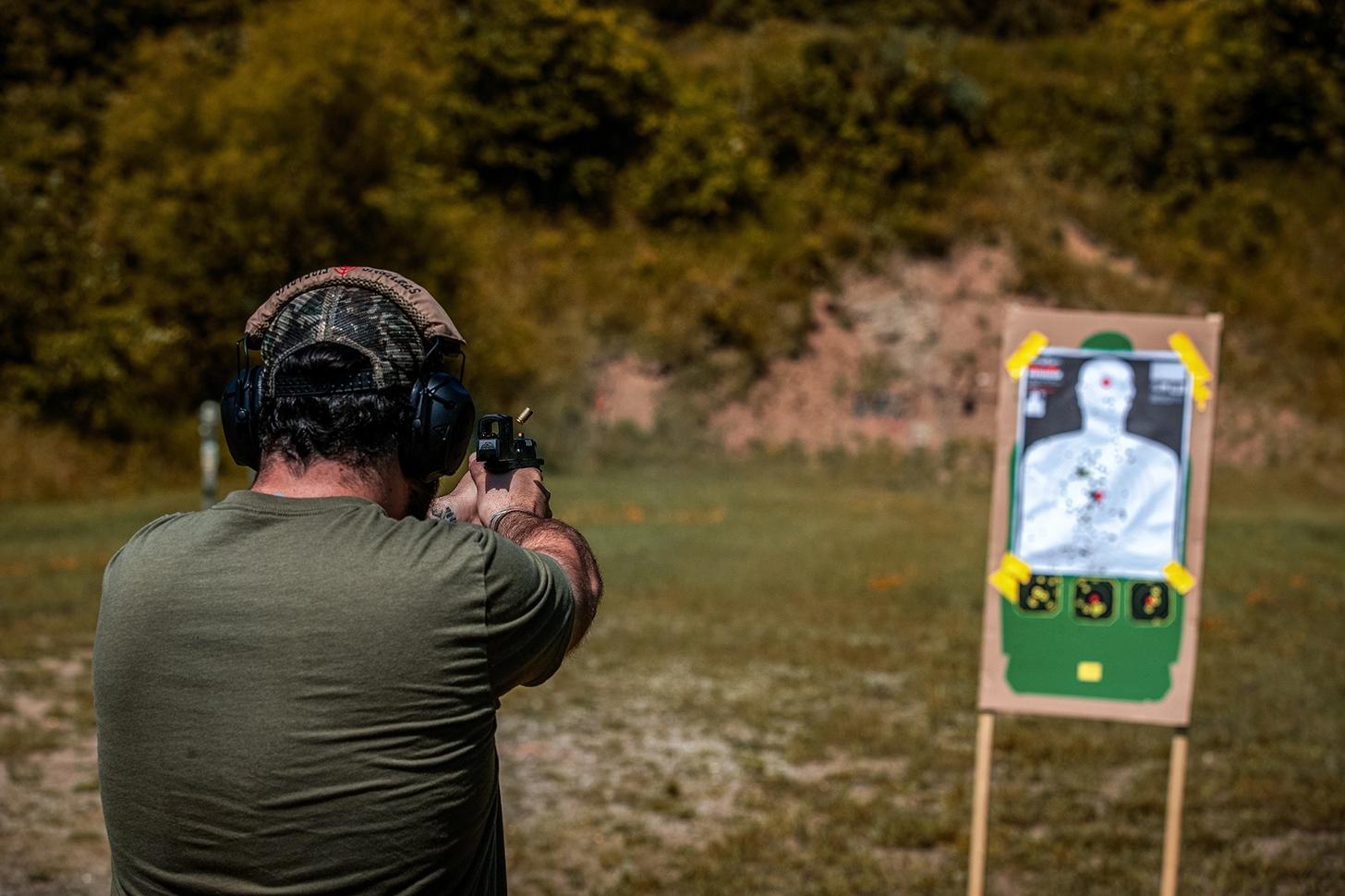A man firing the Walther PDP F Pro ACRO at a target