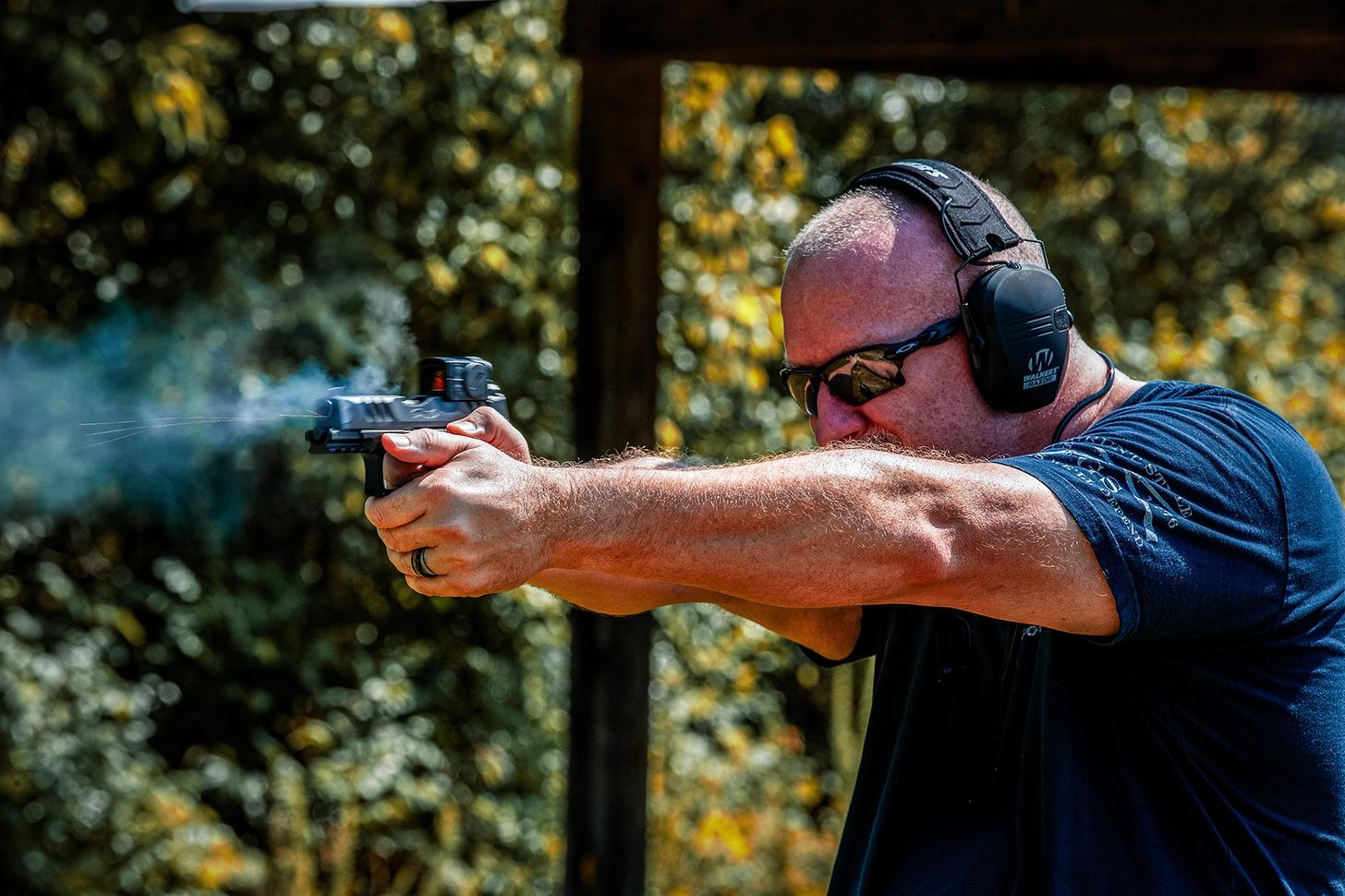 A man firing the Walther PDP F Pro ACRO