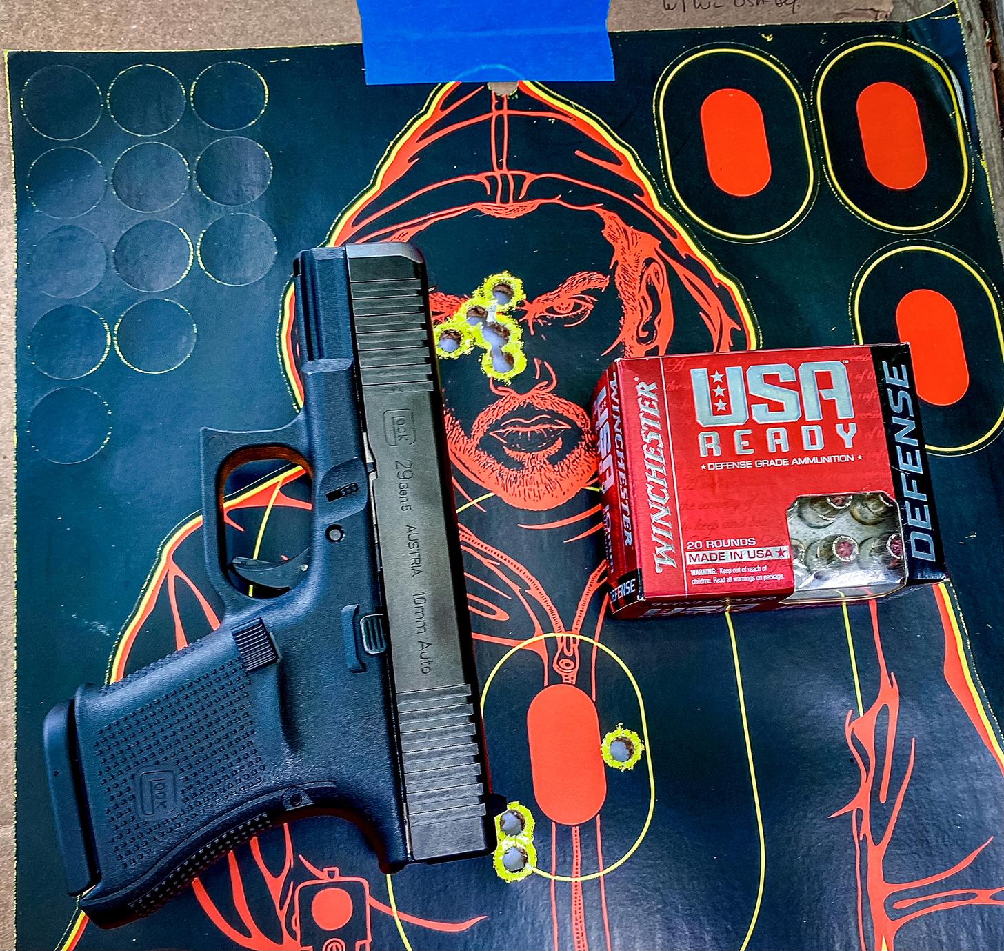 Glock 29 G5 on a shot target with USA Ready defense ammo