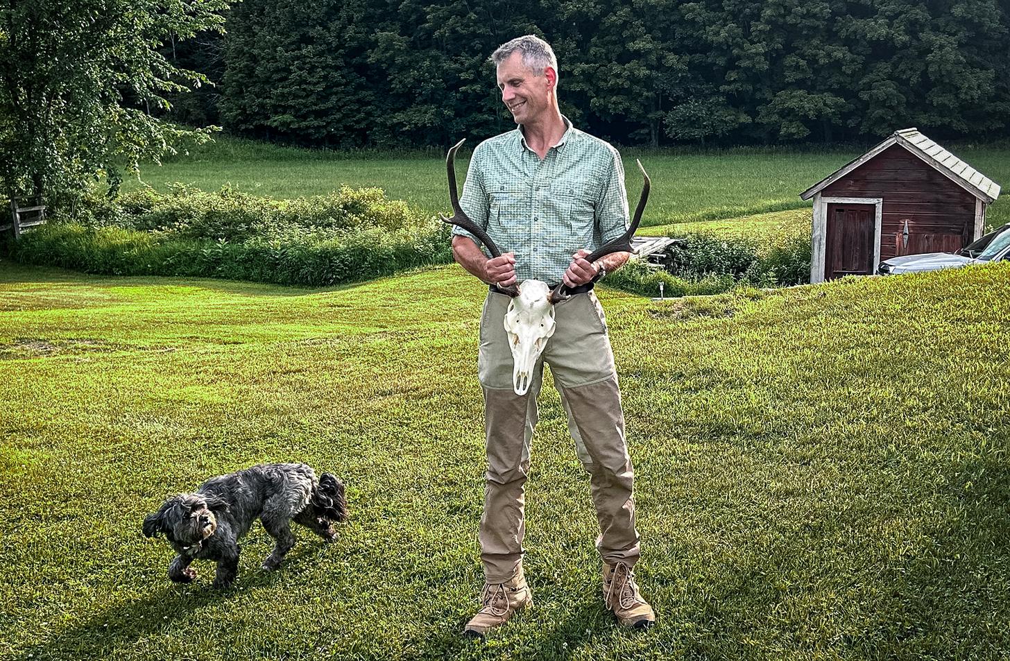 Steve Oster holding a deer skull