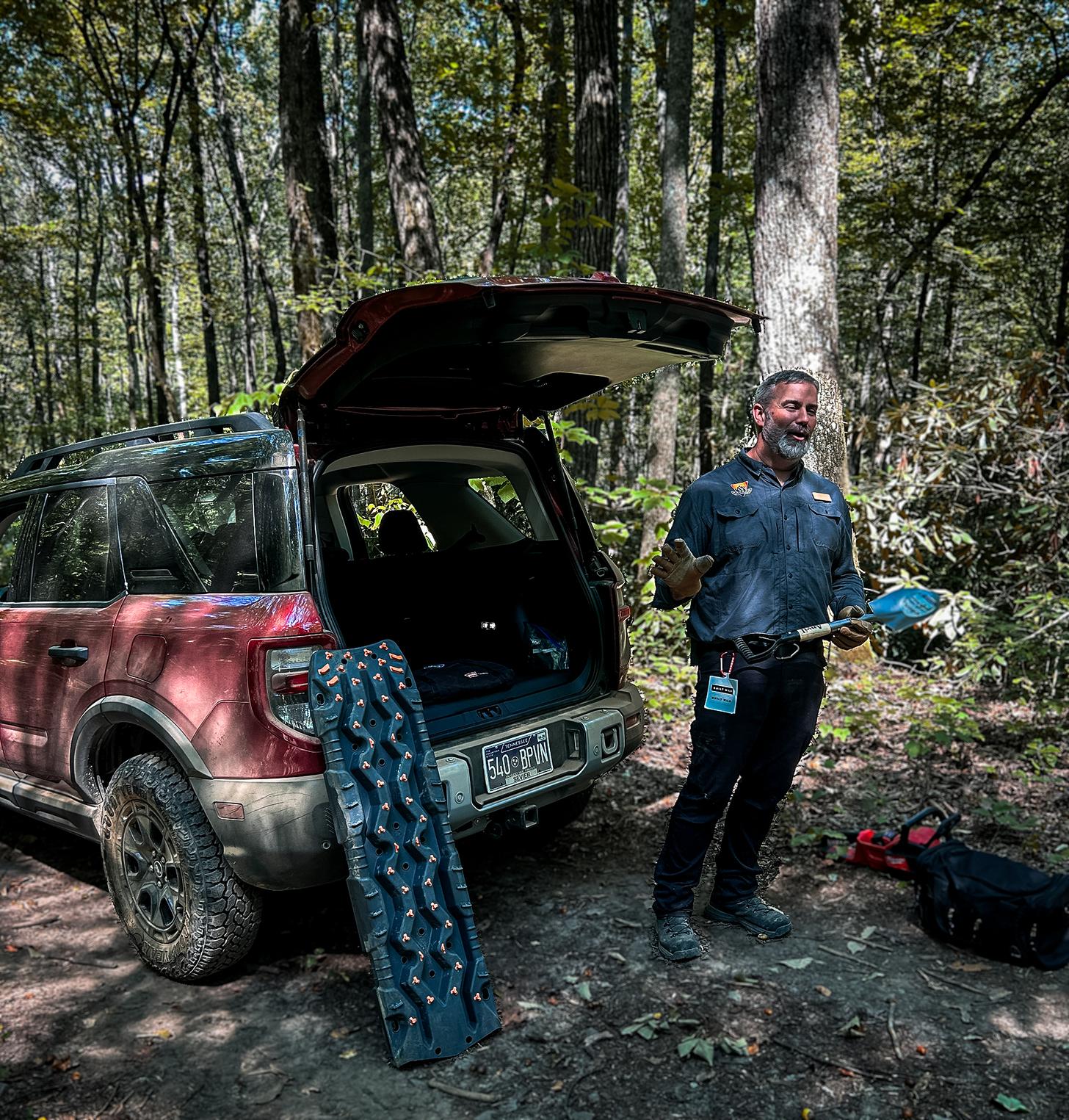 A Ford Off-Roadeo instructor teaches students about the tools and tactics for making off road recoveries.