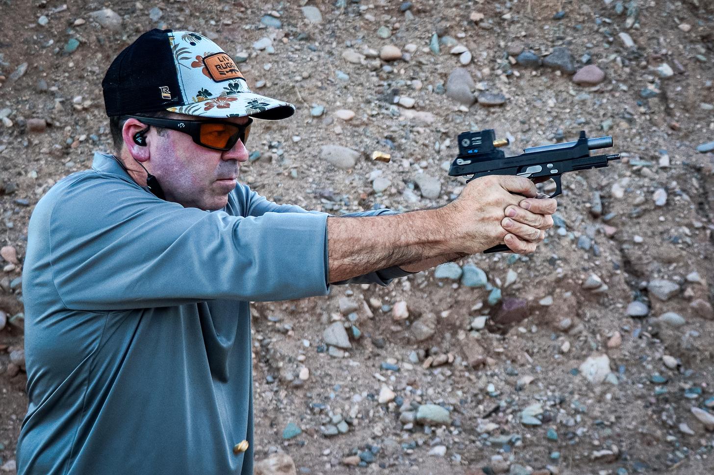 the author shooting the LTT Beretta 92G pistol