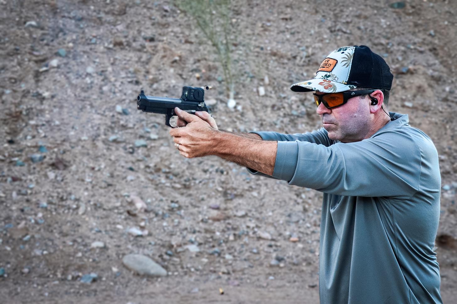 the author shooting the LTT Beretta 92G pistol