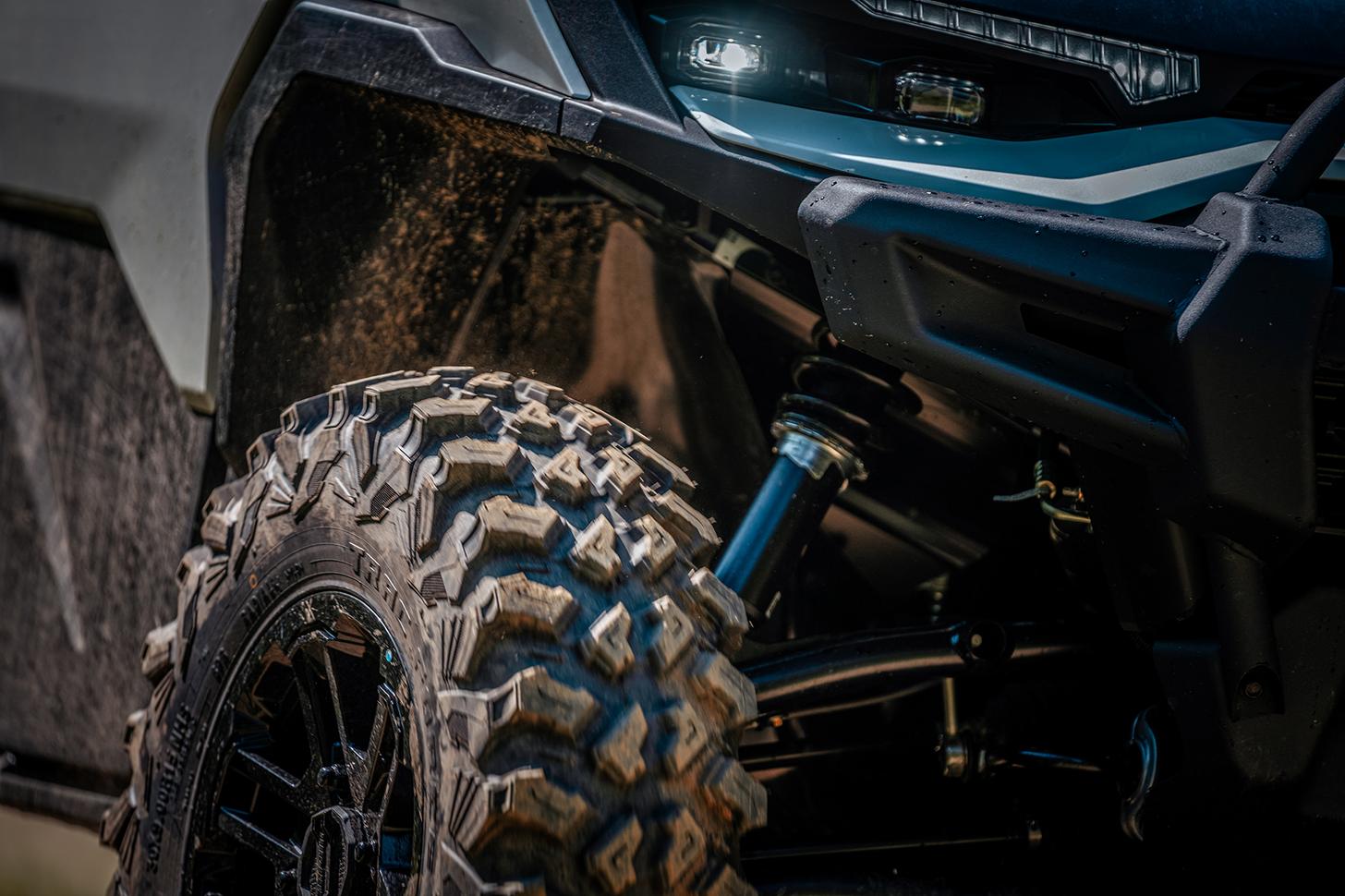 close-up of front tire and suspension of Can-Am Defender