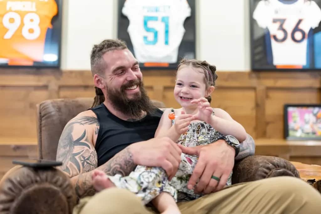 derek wolfe with daughter