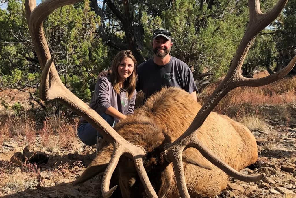 female hunter with elk