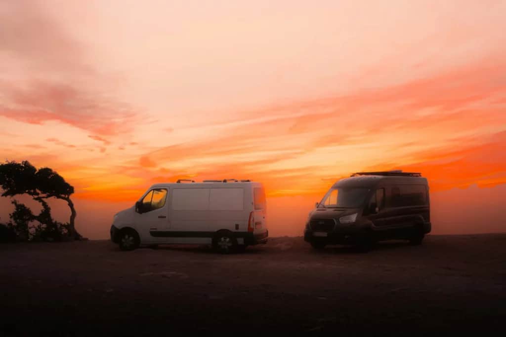 van lifers parked at sunset