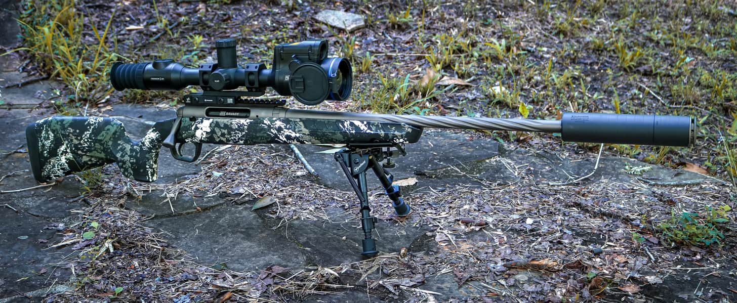 A Savage Axis 2 Pro rifle fitted with a SilencerCo Scythe STM suppressor and a Pulsar Thermion 2 LRF XL60 thermal riflescope