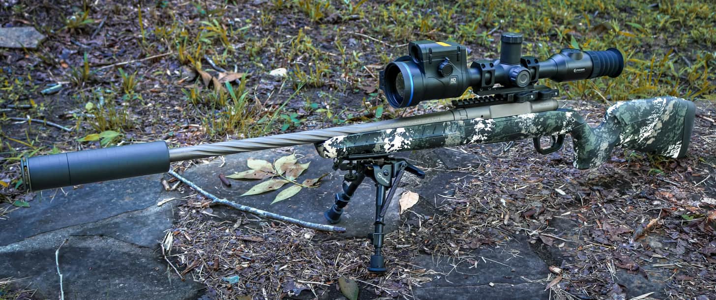 A Savage Axis 2 Pro rifle fitted with a SilencerCo Scythe STM suppressor and a Pulsar Thermion 2 LRF XL60 thermal riflescope