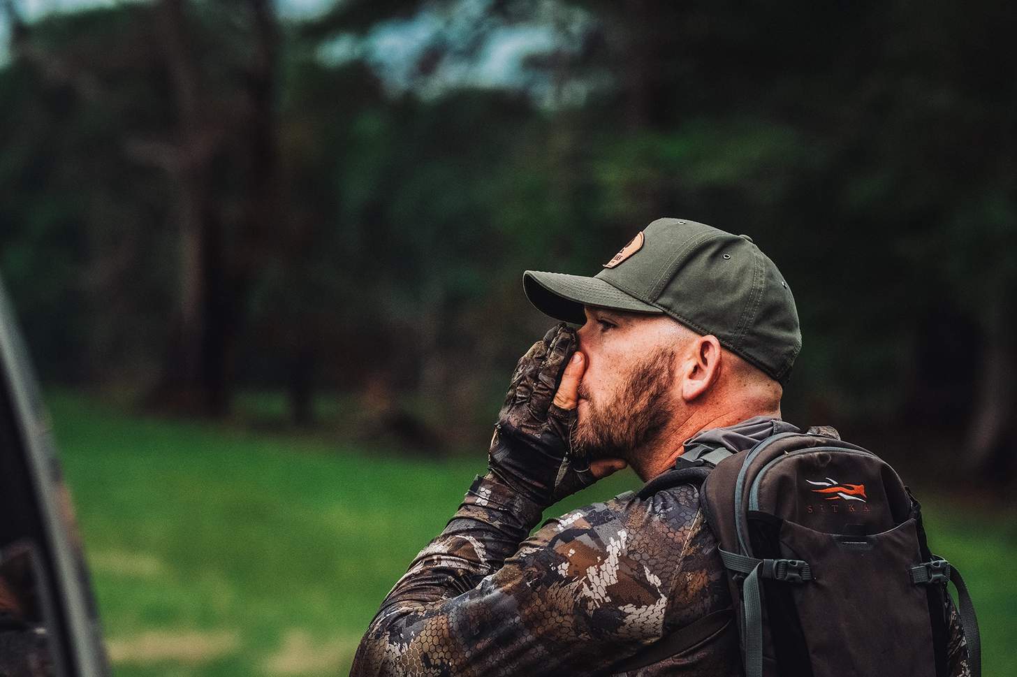 a turkey hunter working a mouth call