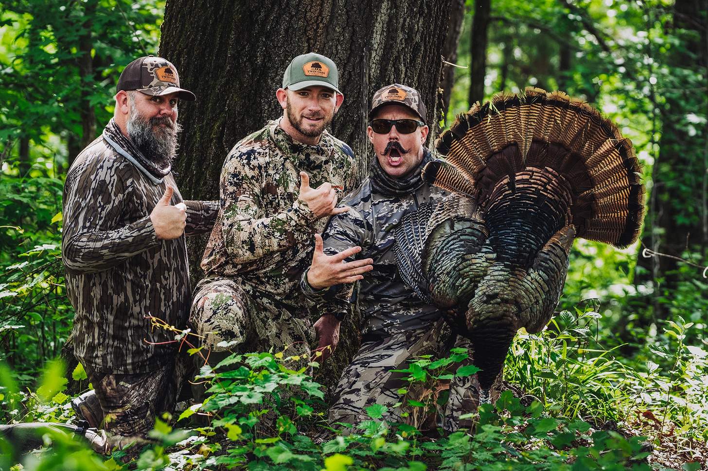 hunters holding a wild turkey