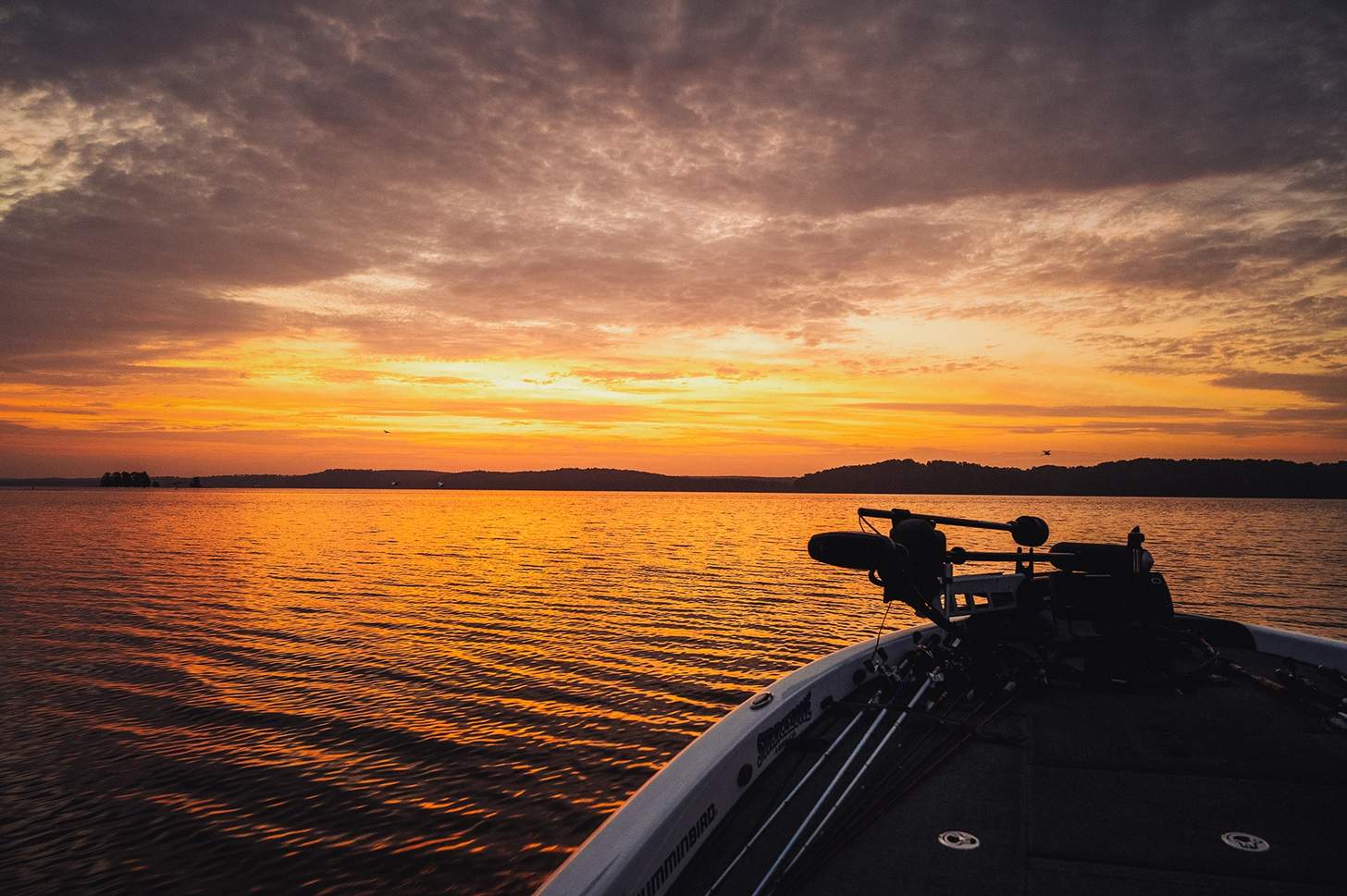sunrise over Lake Eufaula from the bow of a boat