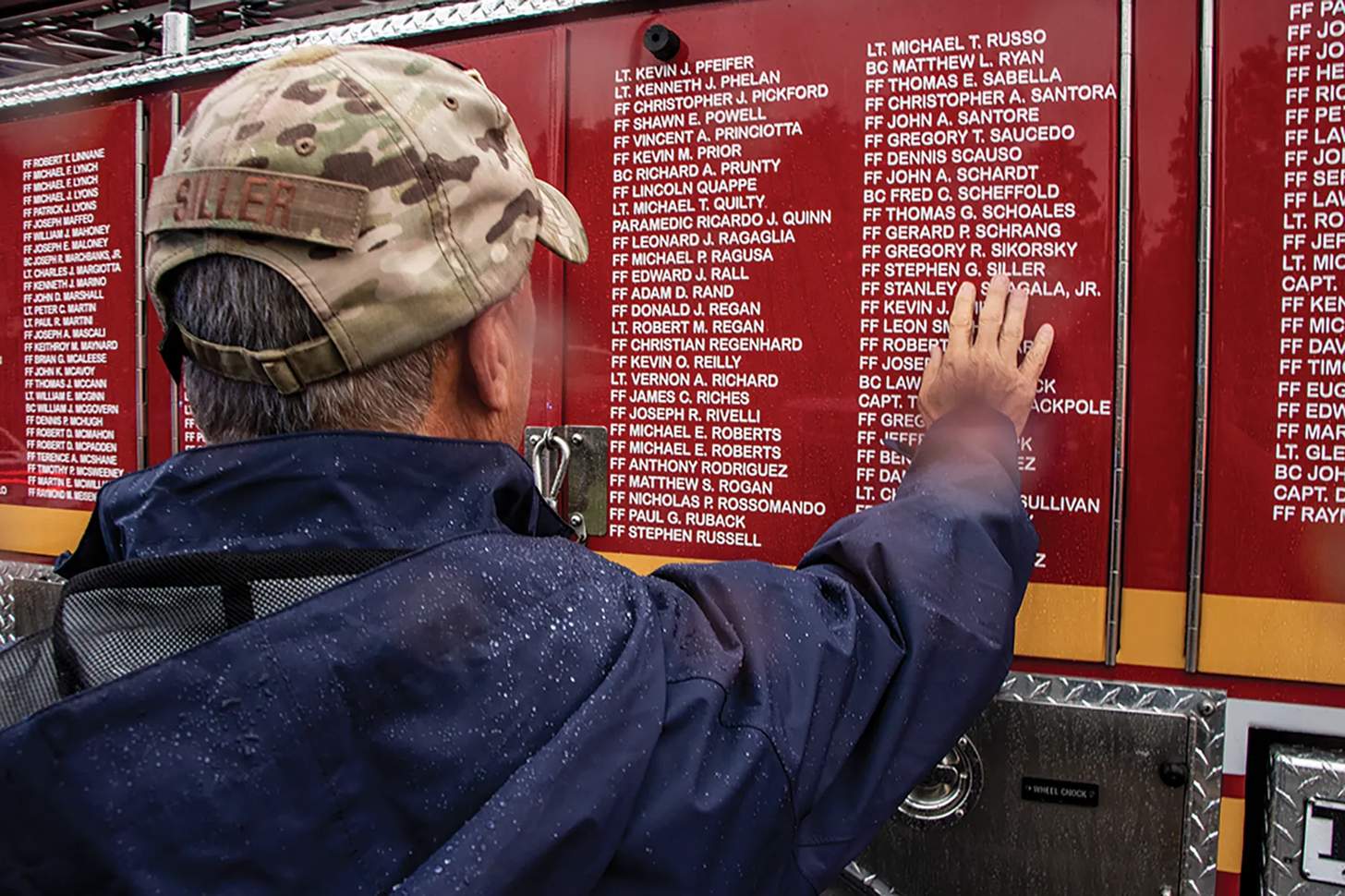 Frank Siller, chairman and CEO of the Tunnel to Towers foundation at firefighter memorial on truck