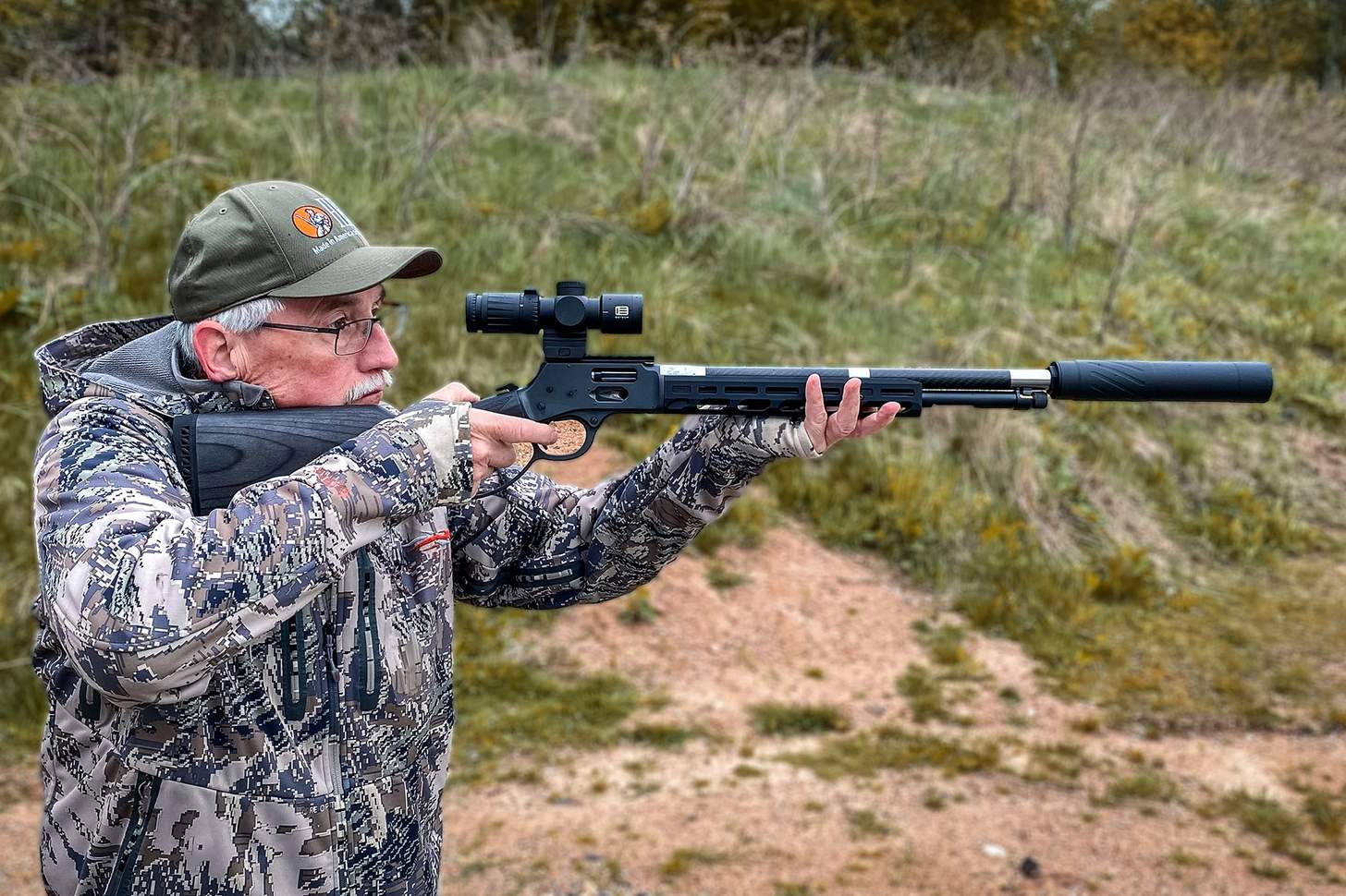 The author shooting the Henry SPD HUSH with a Banish 46-V2 suppressor and a EOTECH VUDU 3-9x32 LPVO optic