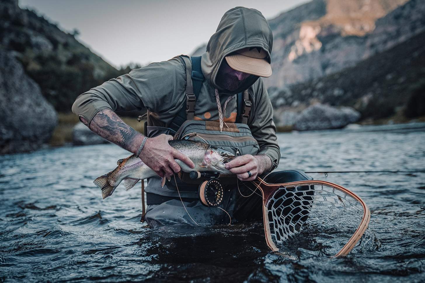 a fly angler wearing the Kifaru Steelhead Chest Rig with the Kifaru Hydro Harness