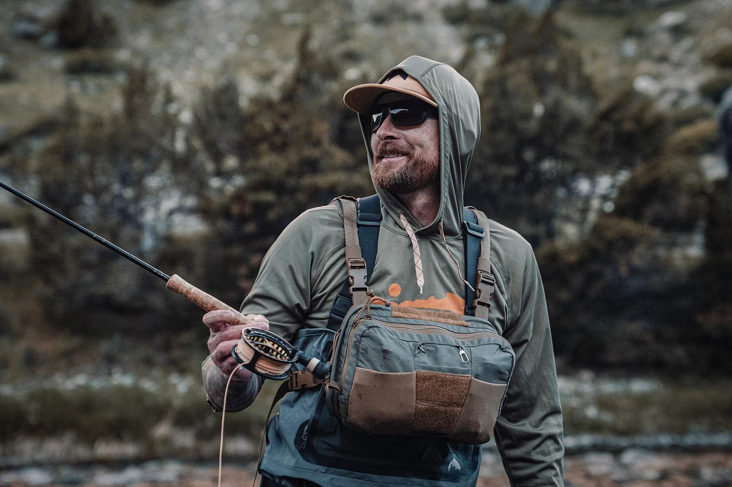 a fly angler wearing the Kifaru Steelhead Chest Rig with the Kifaru Hydro Harness