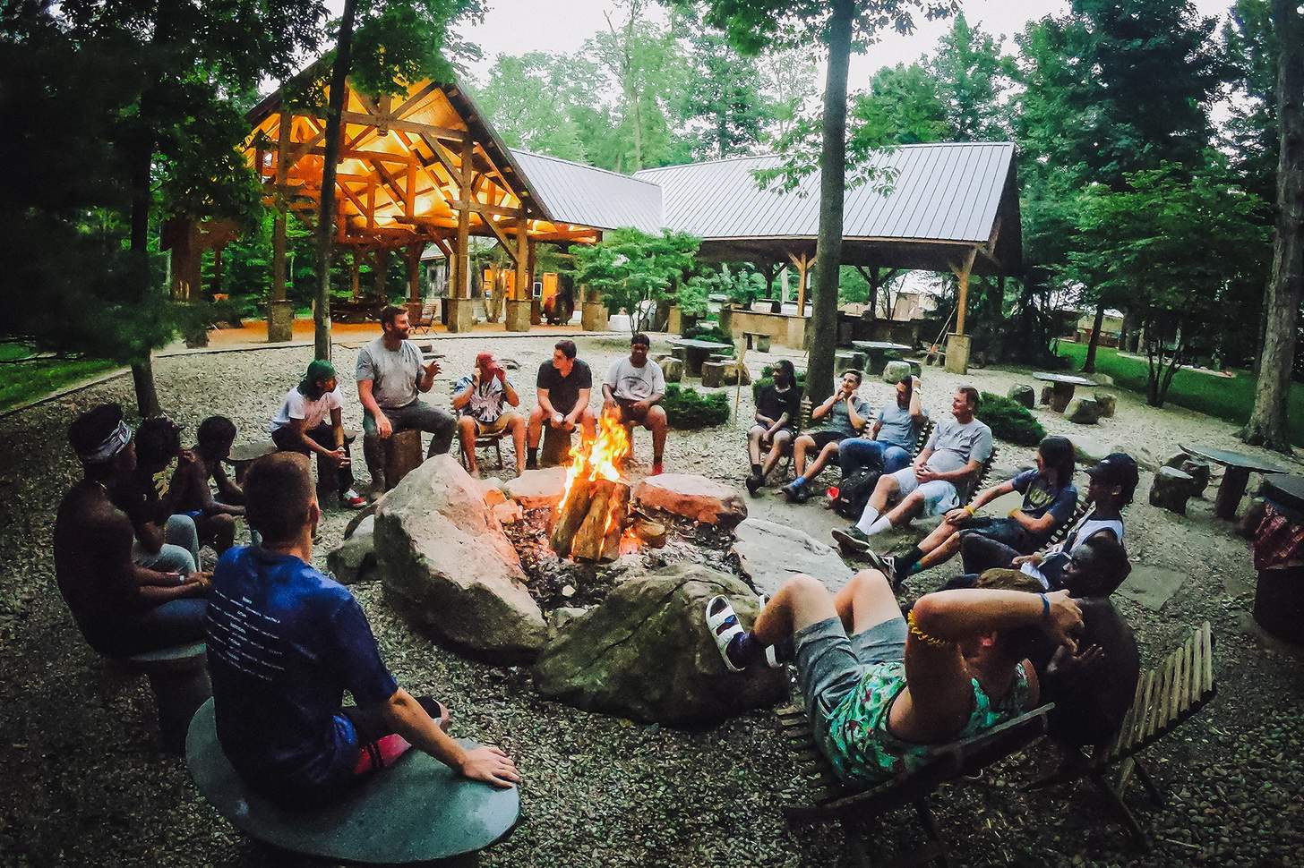 a large group around a fire at Camp Vohokase