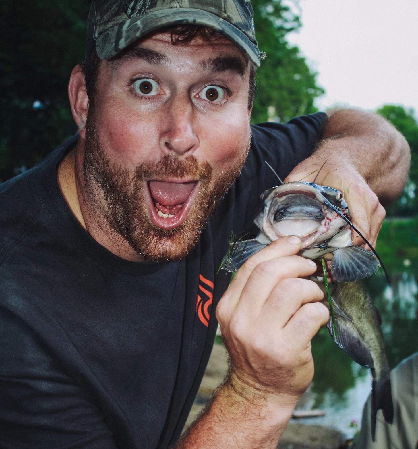 Matt Light clowning with a catfish