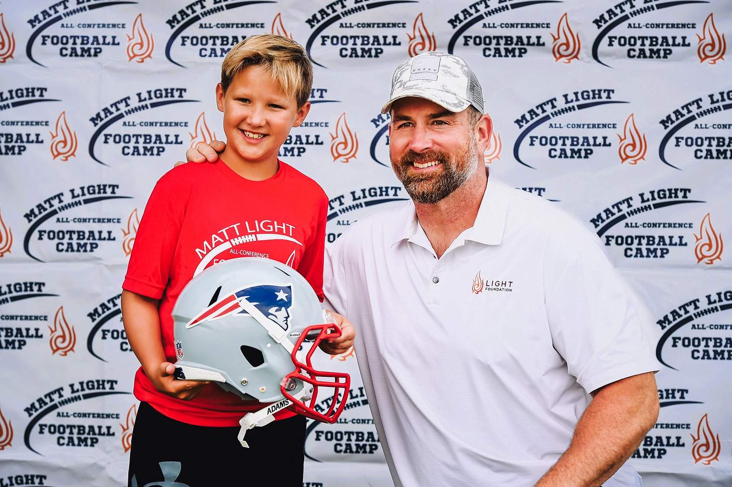 Light and a young fan at the Matt Light All Conference Football Camp