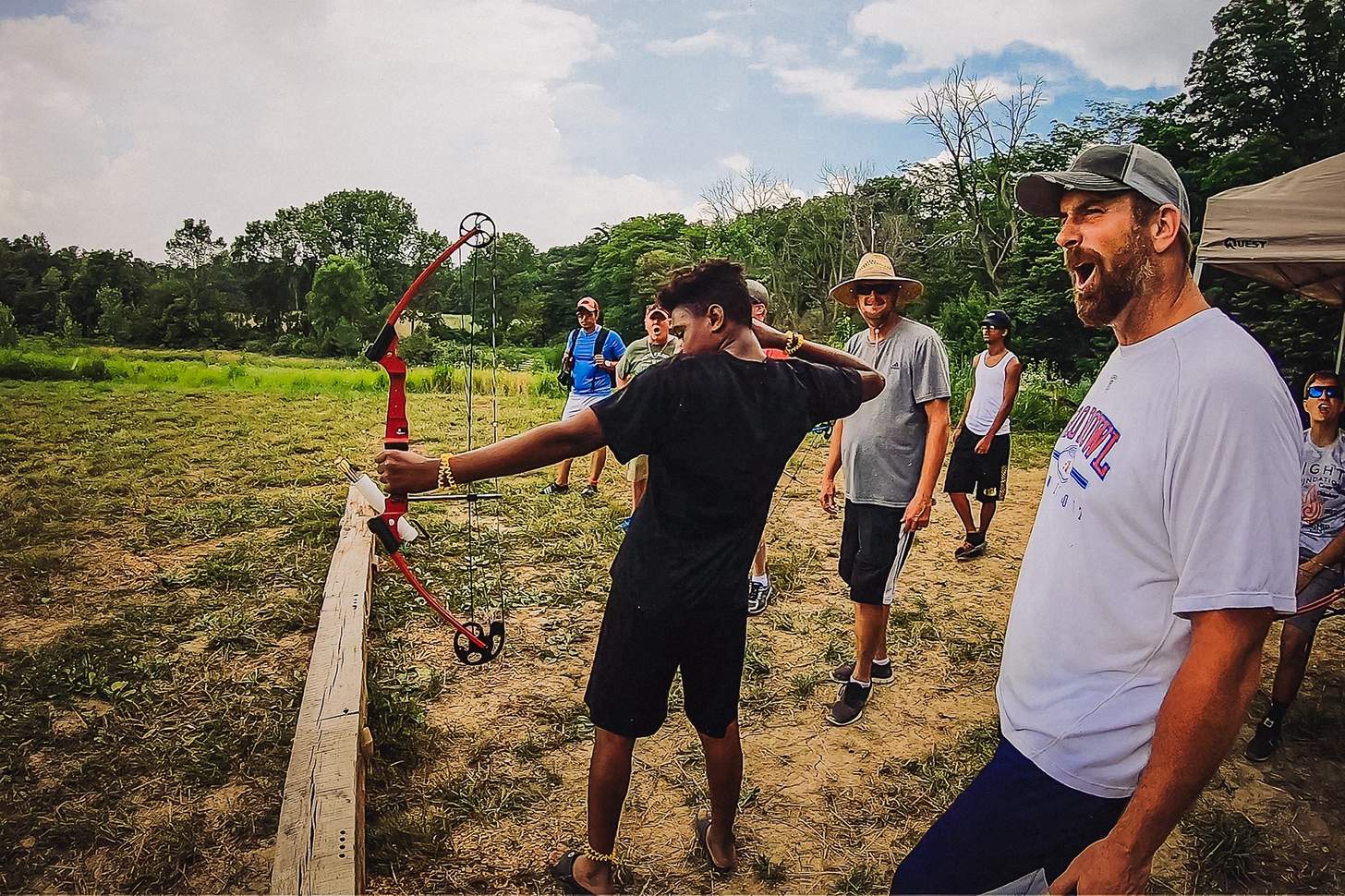 cheering on a young archer